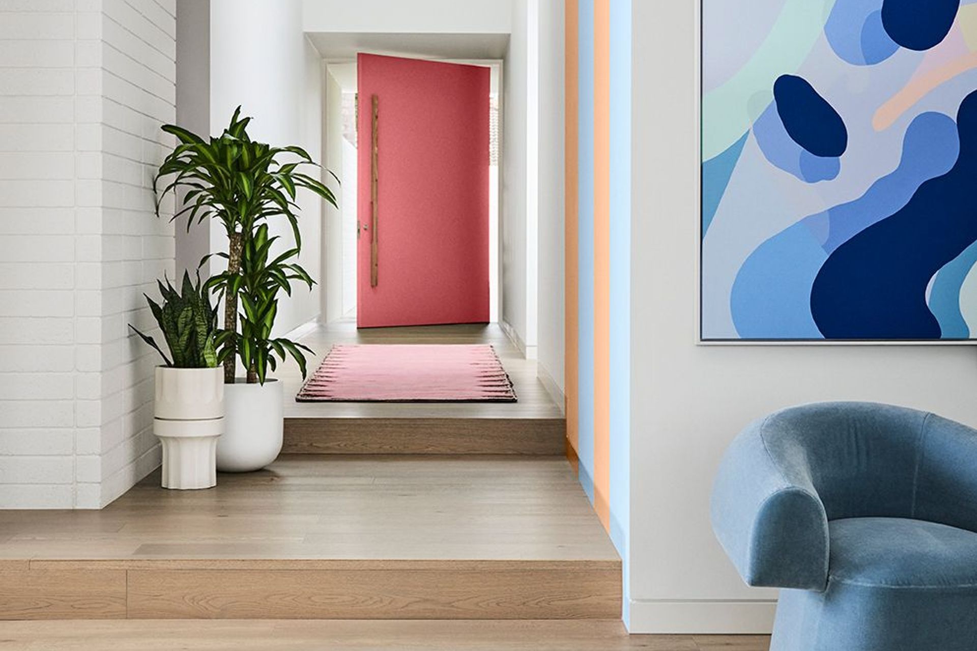 Image supplied by Dulux and features Dulux Ōkārito, stripes in Breezy Half &amp; Herd Street, front door in Ashburton. Artwork: “At Play 2” by Callum Francis. Styling: Bree Leech, Photography: Lisa Cohen.