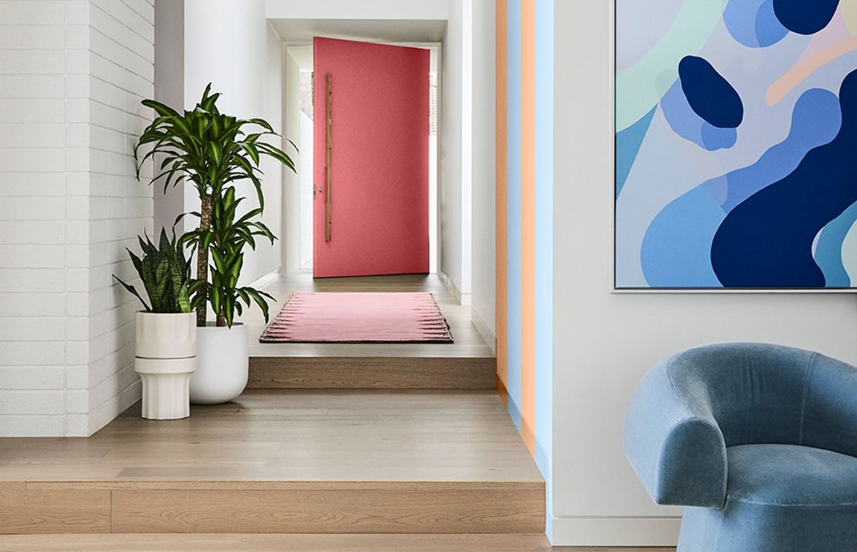 Image supplied by Dulux and features Dulux Ōkārito, stripes in Breezy Half &amp; Herd Street, front door in Ashburton. Artwork: “At Play 2” by Callum Francis. Styling: Bree Leech, Photography: Lisa Cohen.