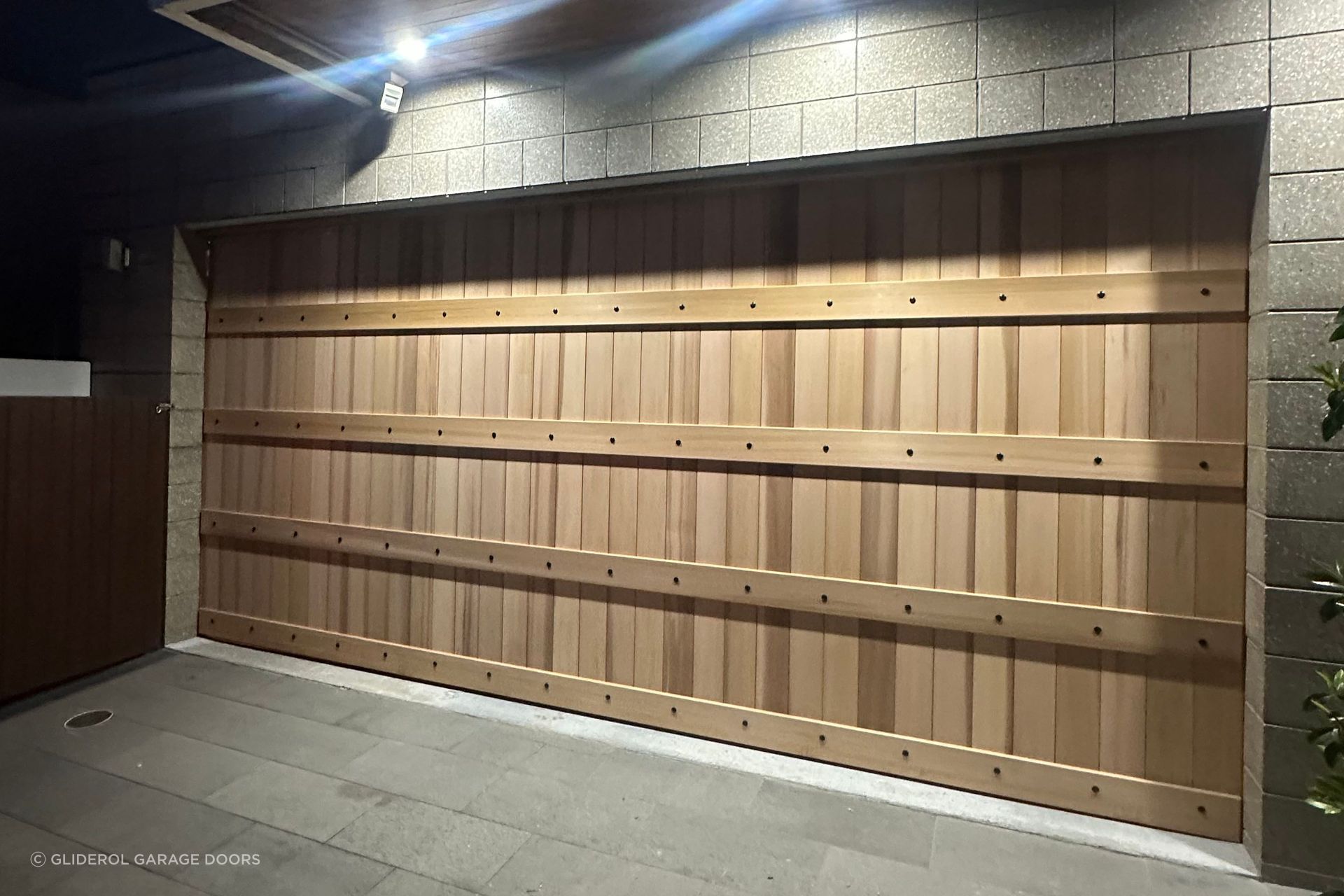 Timber Garage Door in a Danmar barndoor design with a raw finish