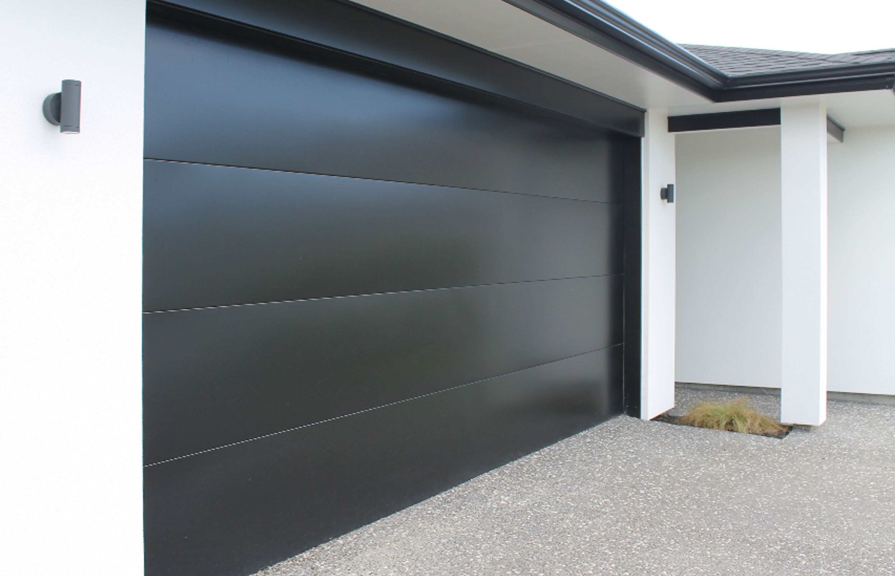 Dominator Sierra is a visually crisp door choice with fine horizontal lines that complement most modern cladding designs and is available in an array of powder coated and zincalume finishes.