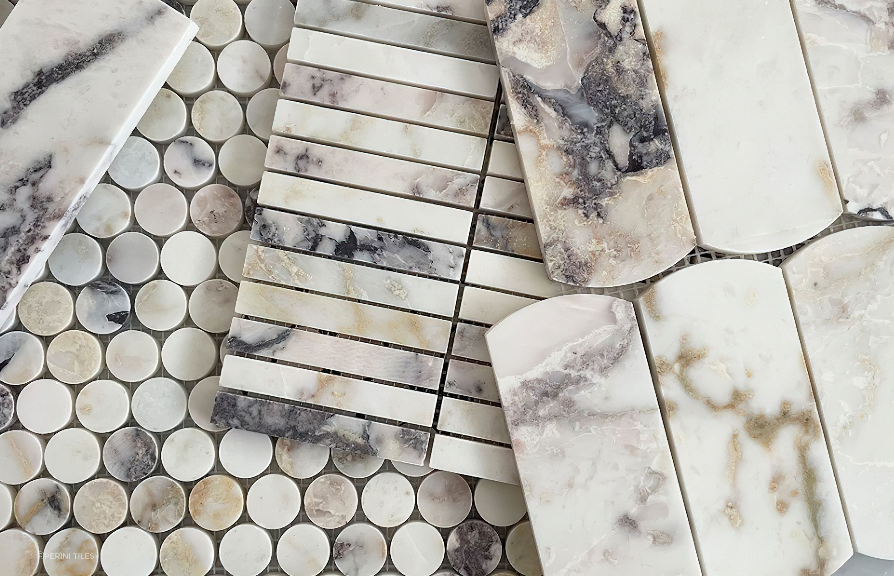 Mosaic tiles are available in a wide variety of tile shapes from stylish Kit Kat tiles, pennyrounds and plenty more. These small format tiles arrive to you already arranged in their pattern with each individual tile attached to a mesh backing sheet. This makes the tiles easier to lay while keeping their pattern in order. Pictured: Our luxurious natural marble, Dorado Stone collection.