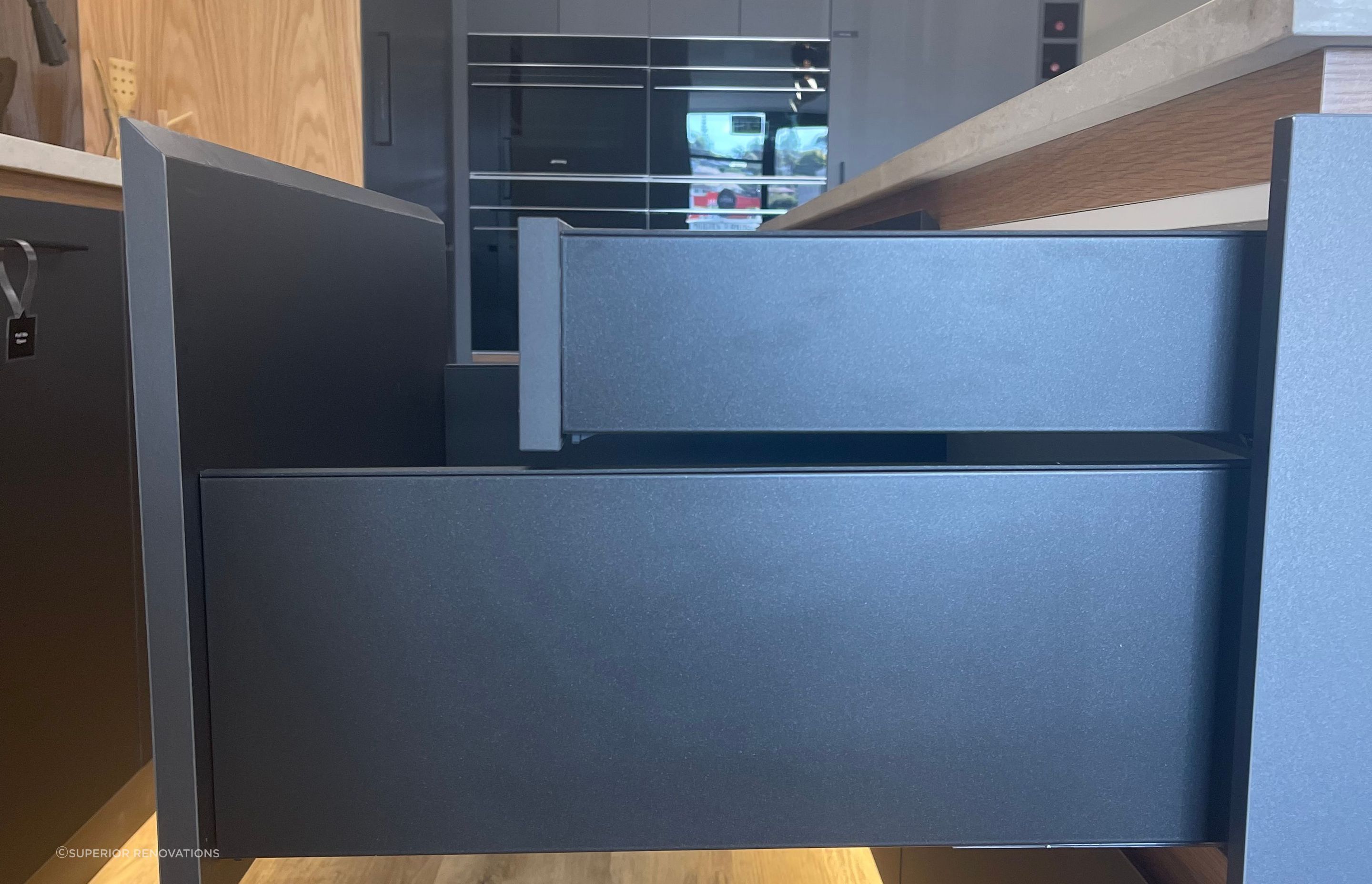 Smaller hidden drawers within the larger drawers to create an even and seamless look from the exterior.