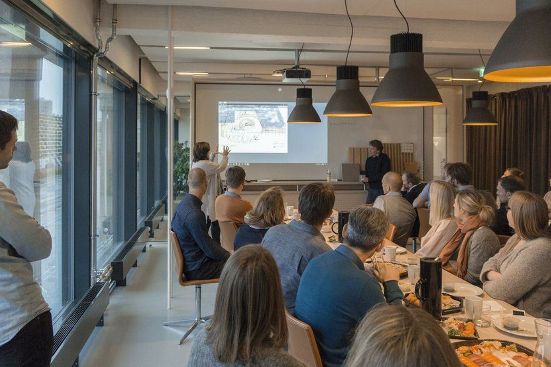 A weekly communal lunch + internal design presentation in progress