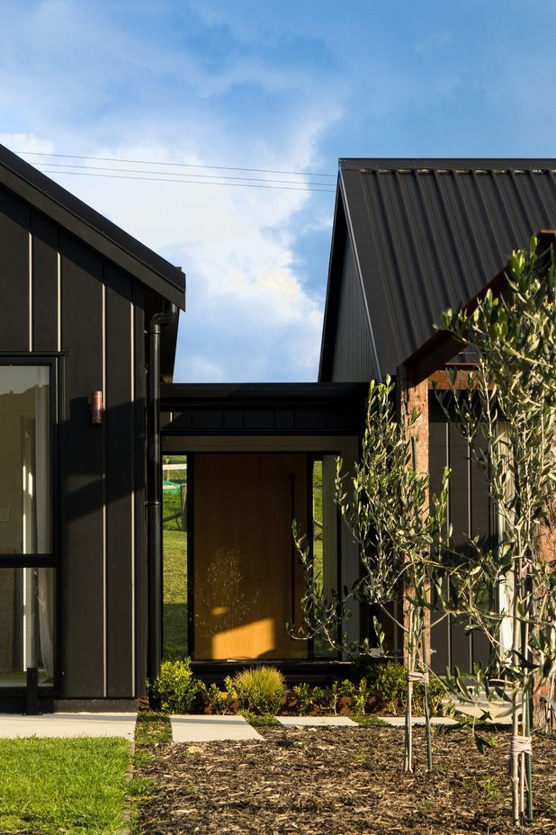 Floor to ceiling windows allow all-day sun into the Otaika Valley home.
