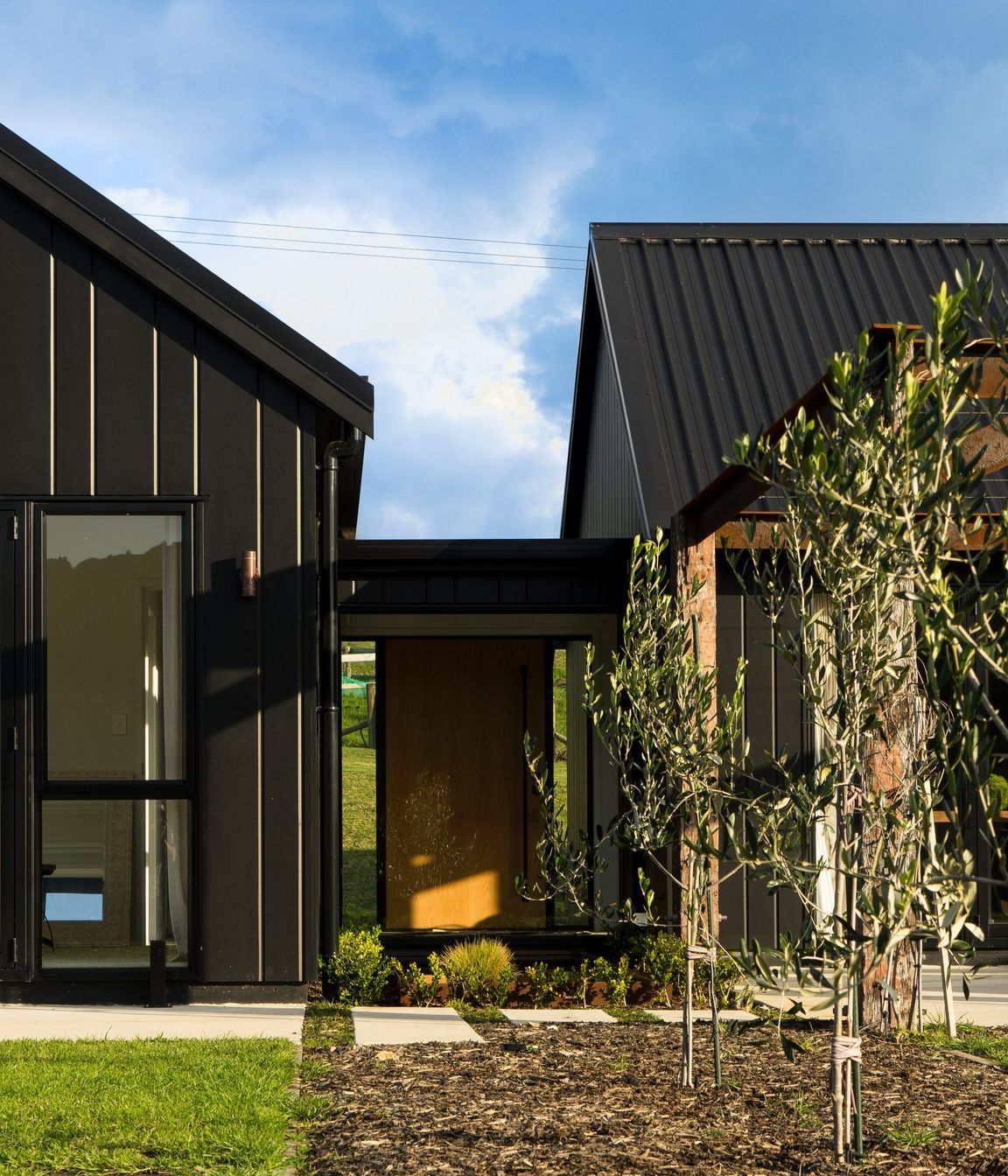 Floor to ceiling windows allow all-day sun into the Otaika Valley home.