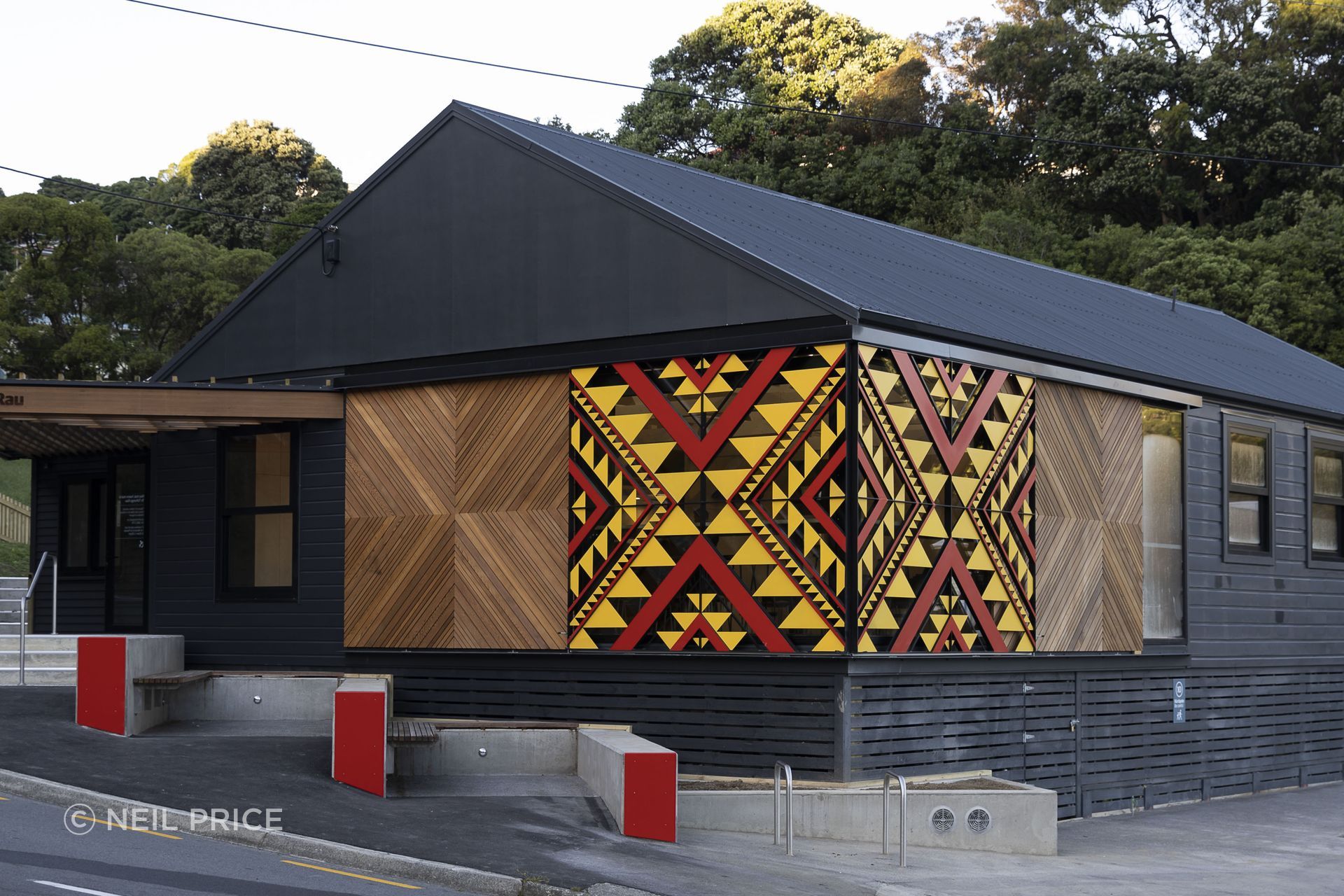 Te Tūhunga Rau Community Centre, in the Wellington suburb of Strathmore Park, features exterior cladding in Resene Sonyx 101 Semi-gloss CoolColour in Double Foundry, and matching roof finished in Summit Roof Semi-gloss CoolColour. Project: Etch Architecture.