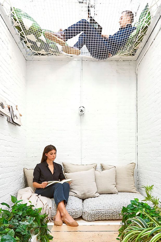 Converted elevator shaft lounge area in the office of Elizabeth Roberts Architects