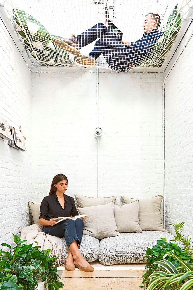 Converted elevator shaft lounge area in the office of Elizabeth Roberts Architects
