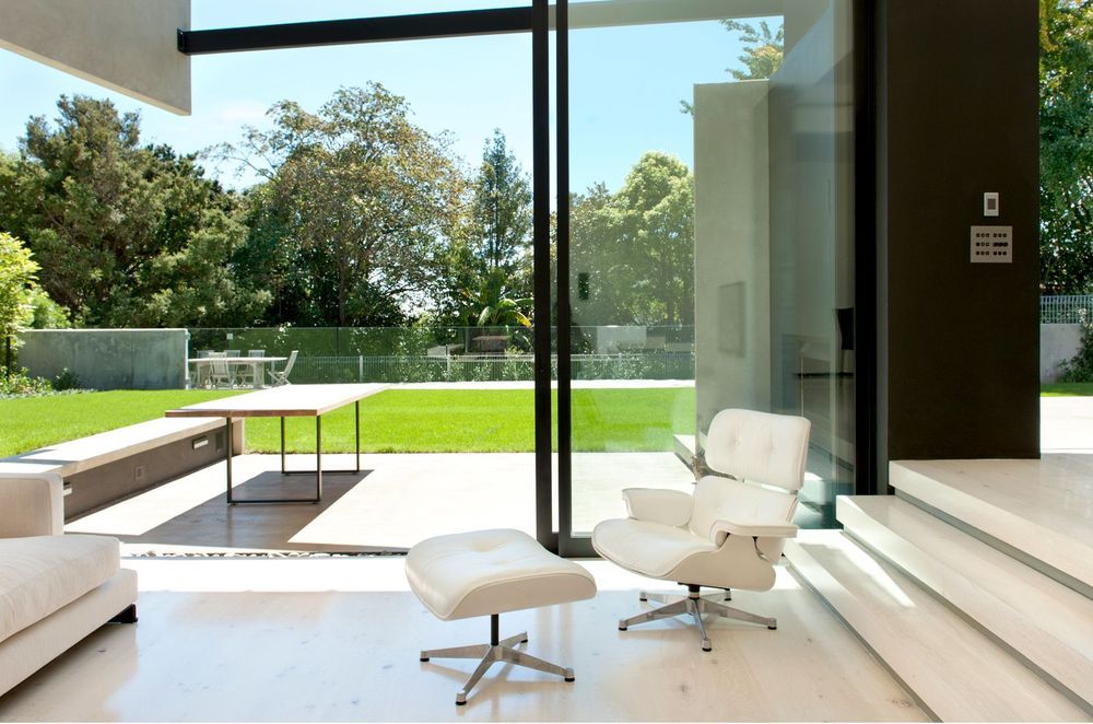 The concrete clad exterior is matched inside with concrete flooring - Photography: Emily Andrews & Ernie Shackles