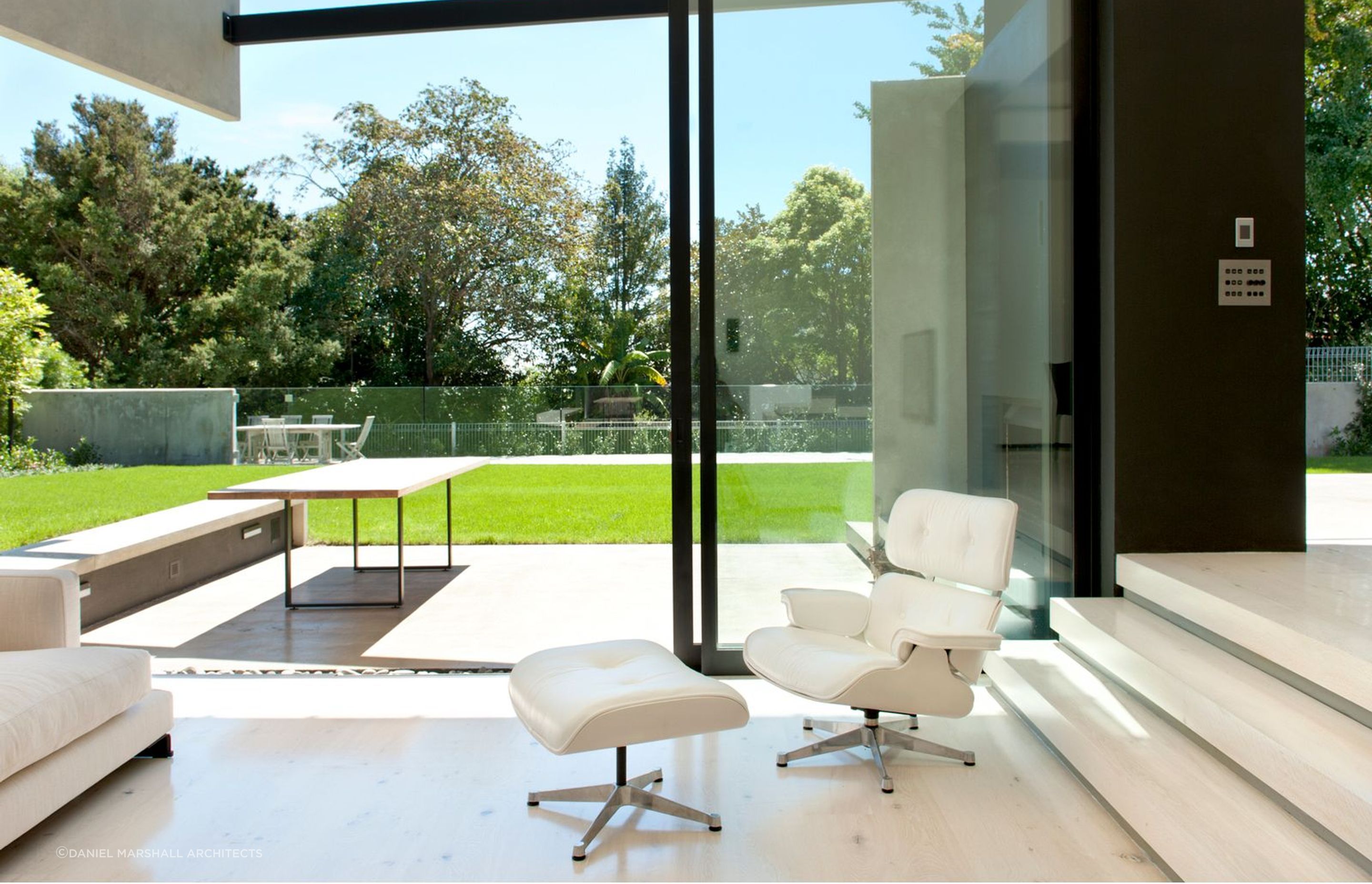The concrete clad exterior is matched inside with concrete flooring - Photography: Emily Andrews & Ernie Shackles