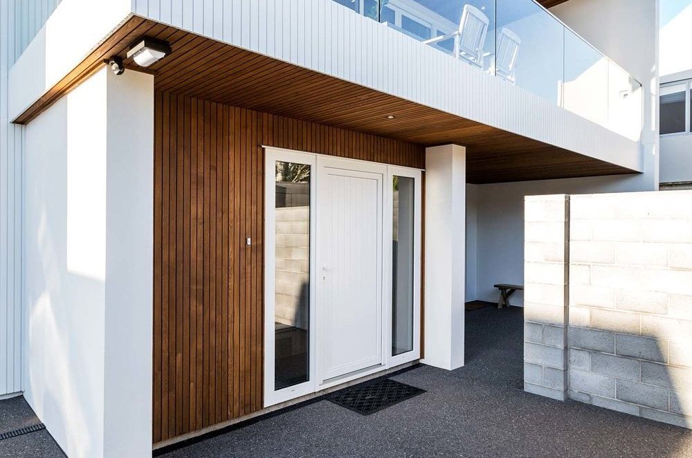 Window panels on either side of an entry door gives a nice feeling of symmetry