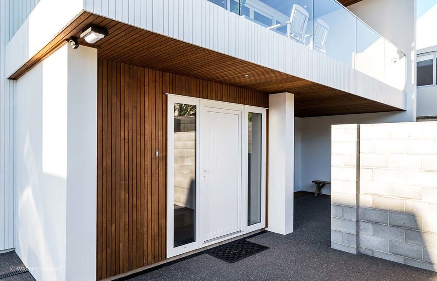 Window panels on either side of an entry door gives a nice feeling of symmetry