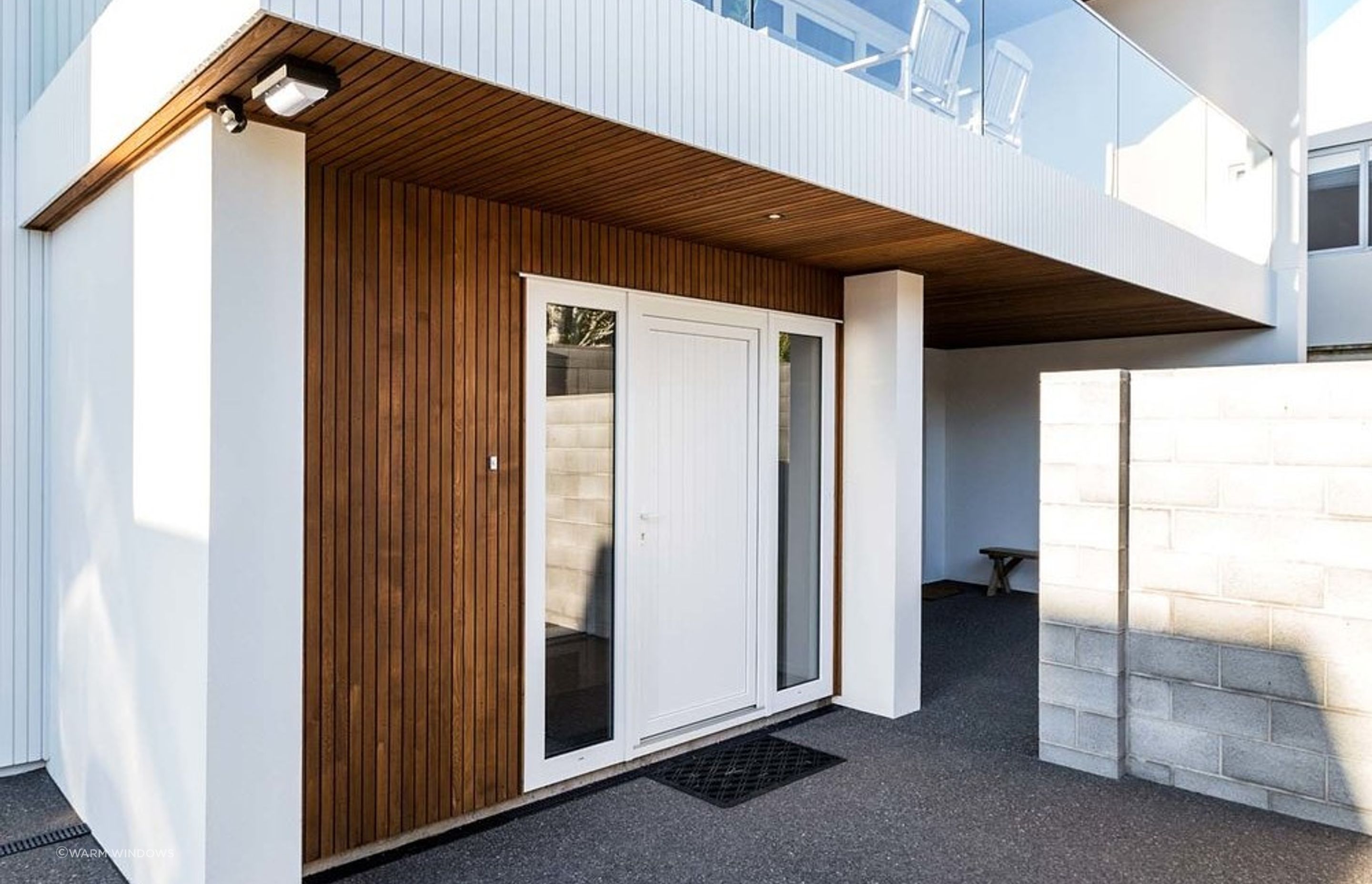 Window panels on either side of an entry door gives a nice feeling of symmetry