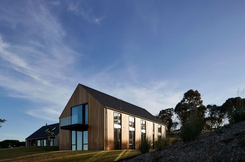 A stylish balcony offers panoramic view of the surrounding landscapes. Photographer: Shannon McGrath.