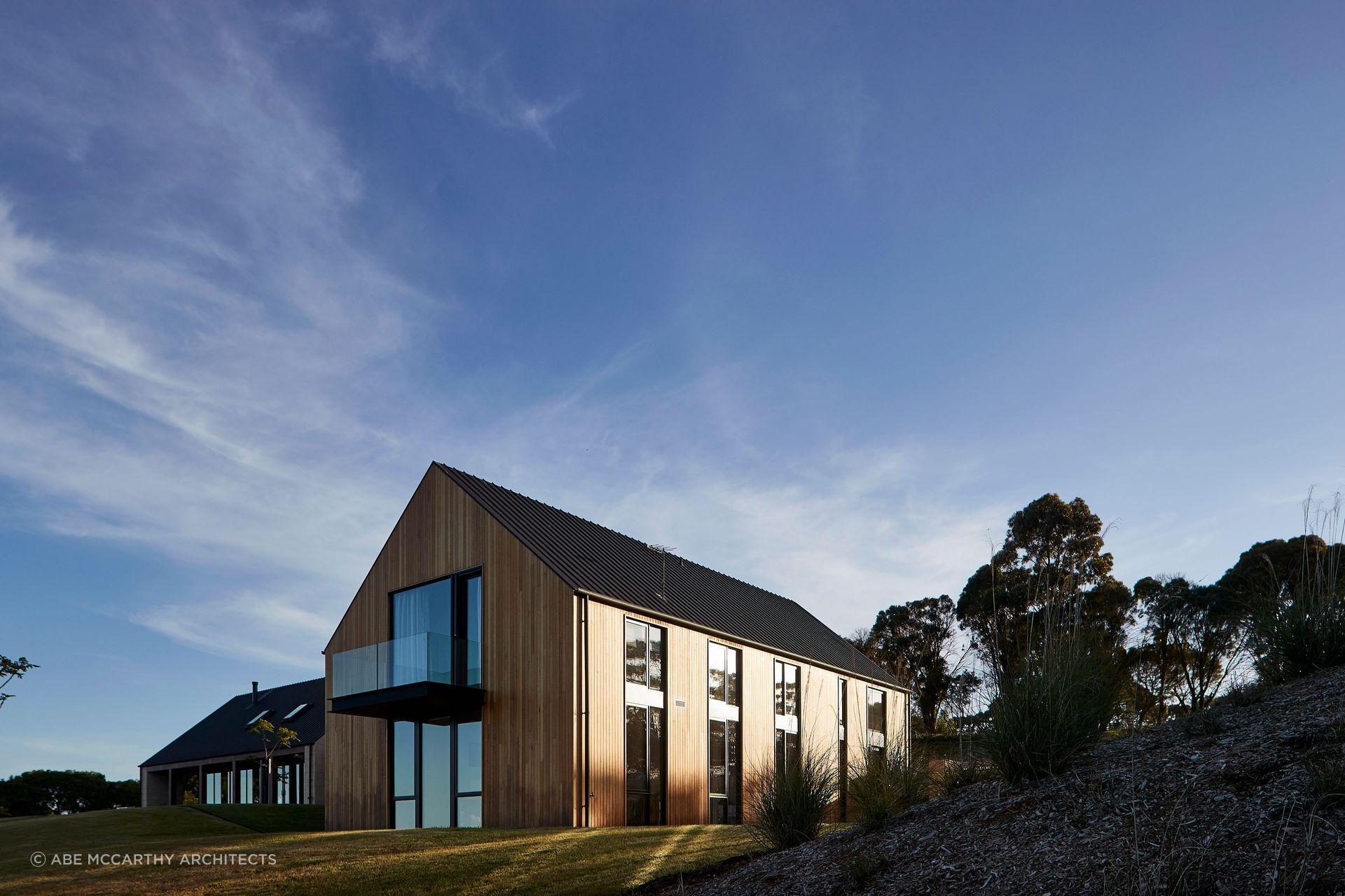 A stylish balcony offers panoramic view of the surrounding landscapes. Photographer: Shannon McGrath.