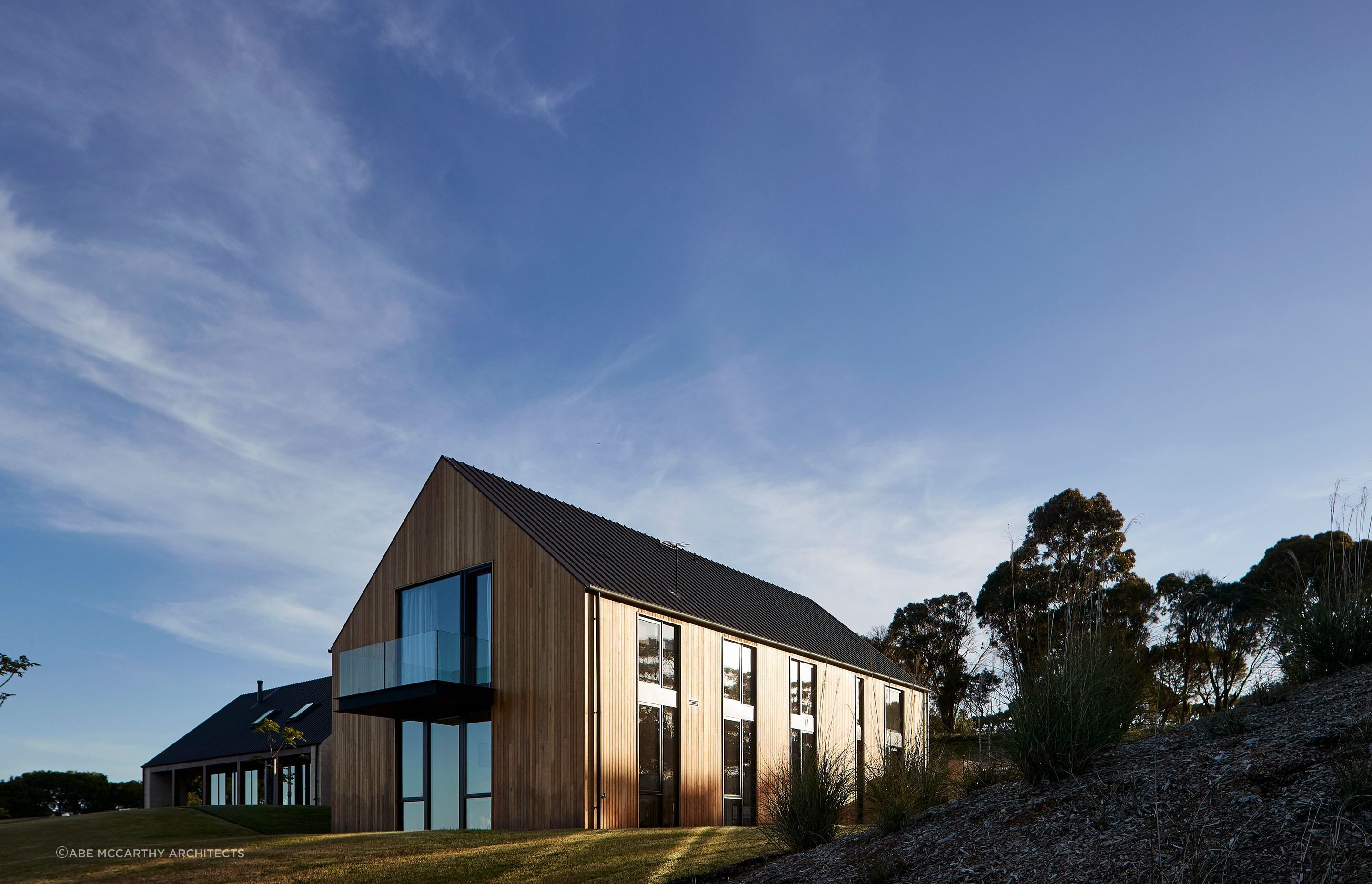 A stylish balcony offers panoramic view of the surrounding landscapes. Photographer: Shannon McGrath.