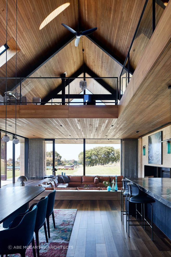 Inside the barn house, timber ceilings create a warm and inviting atmosphere Photographer: Shannon McGrath