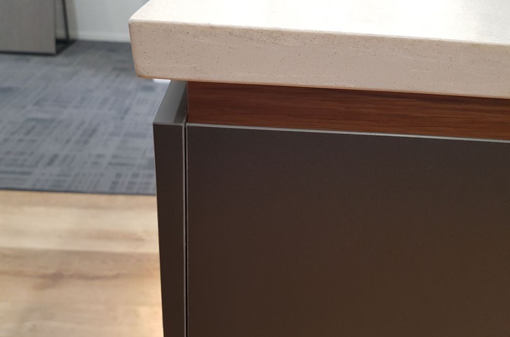 Premium Acrylic panels on MDF boards for all the cabinet and drawer fronts. Recessed Veneer below the stone engineered countertop gives the benchtop an appearance of floating.