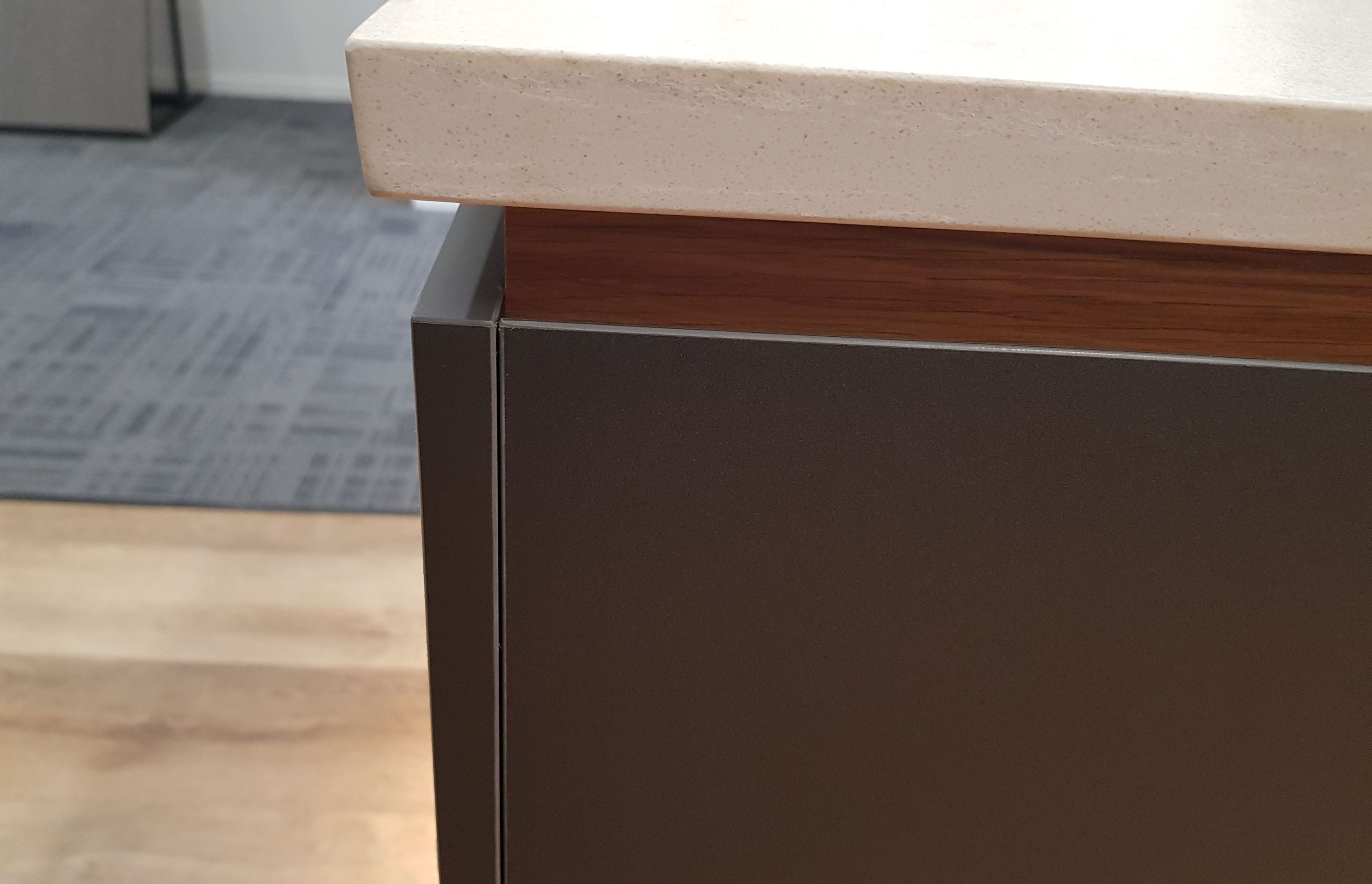 Premium Acrylic panels on MDF boards for all the cabinet and drawer fronts. Recessed Veneer below the stone engineered countertop gives the benchtop an appearance of floating.