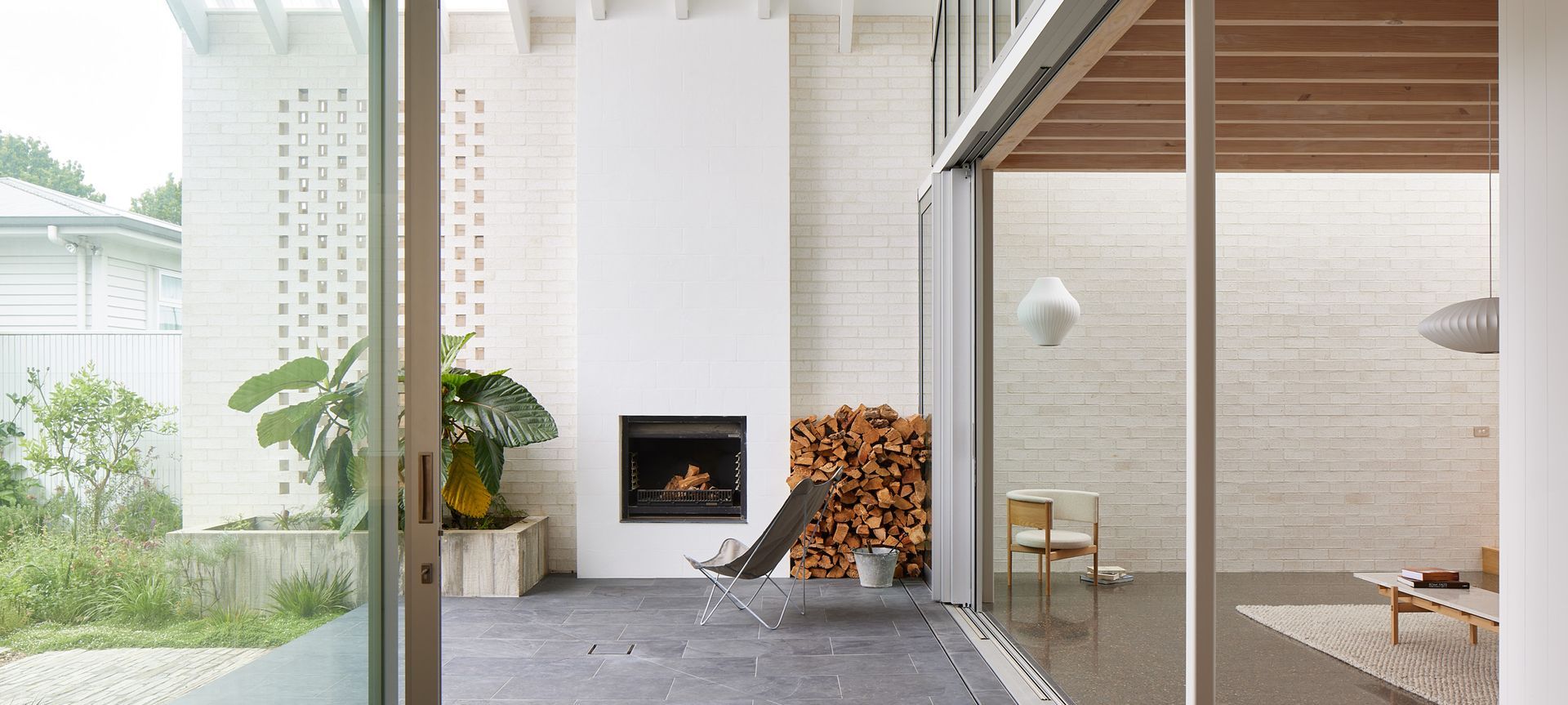 Point House by Guy Tarrant Architects with furniture from Good Form – N-CC01 Lounge Chair and N-CT01 Coffee Table by Karimoku Case. Photography by Simon Wilson