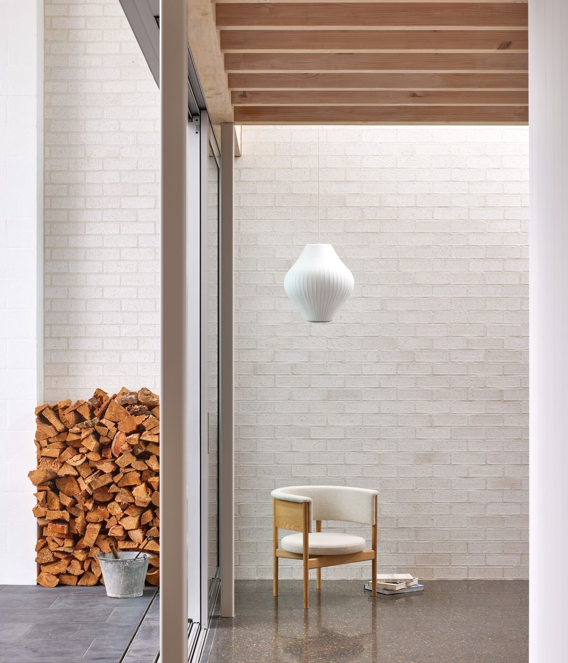 Point House by Guy Tarrant Architects with furniture from Good Form – N-CC01 Lounge Chair by Karimoku Case
