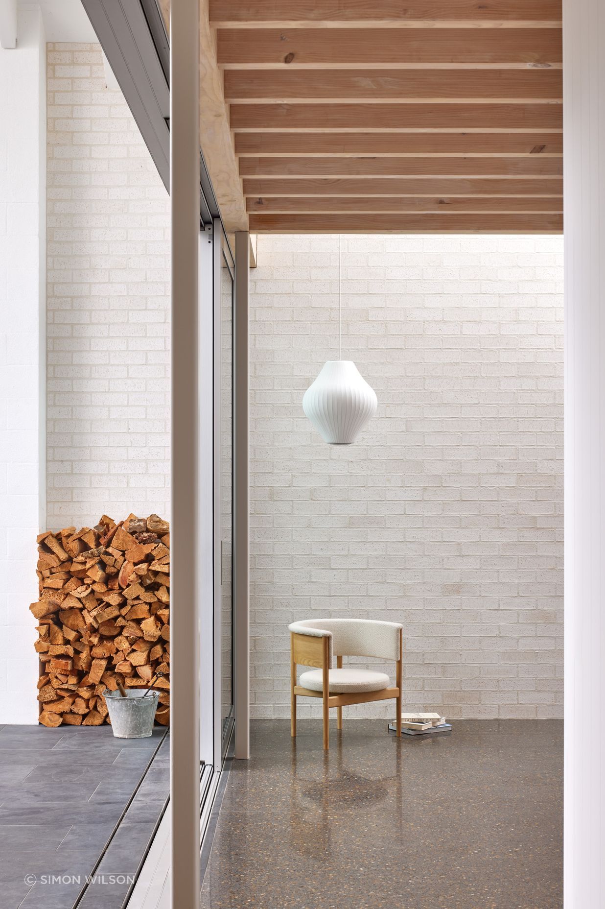 Point House by Guy Tarrant Architects with furniture from Good Form – N-CC01 Lounge Chair by Karimoku Case