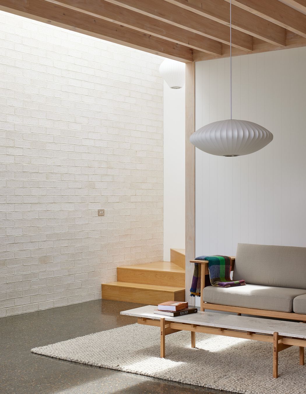 Point House by Guy Tarrant Architects with furniture from Good Form – N-CT01 Coffee Table and N-S01 Sofa by Karimoku Case