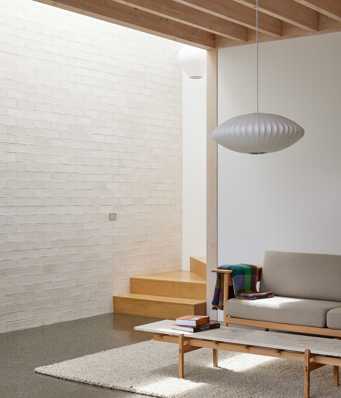 Point House by Guy Tarrant Architects with furniture from Good Form – N-CT01 Coffee Table and N-S01 Sofa by Karimoku Case