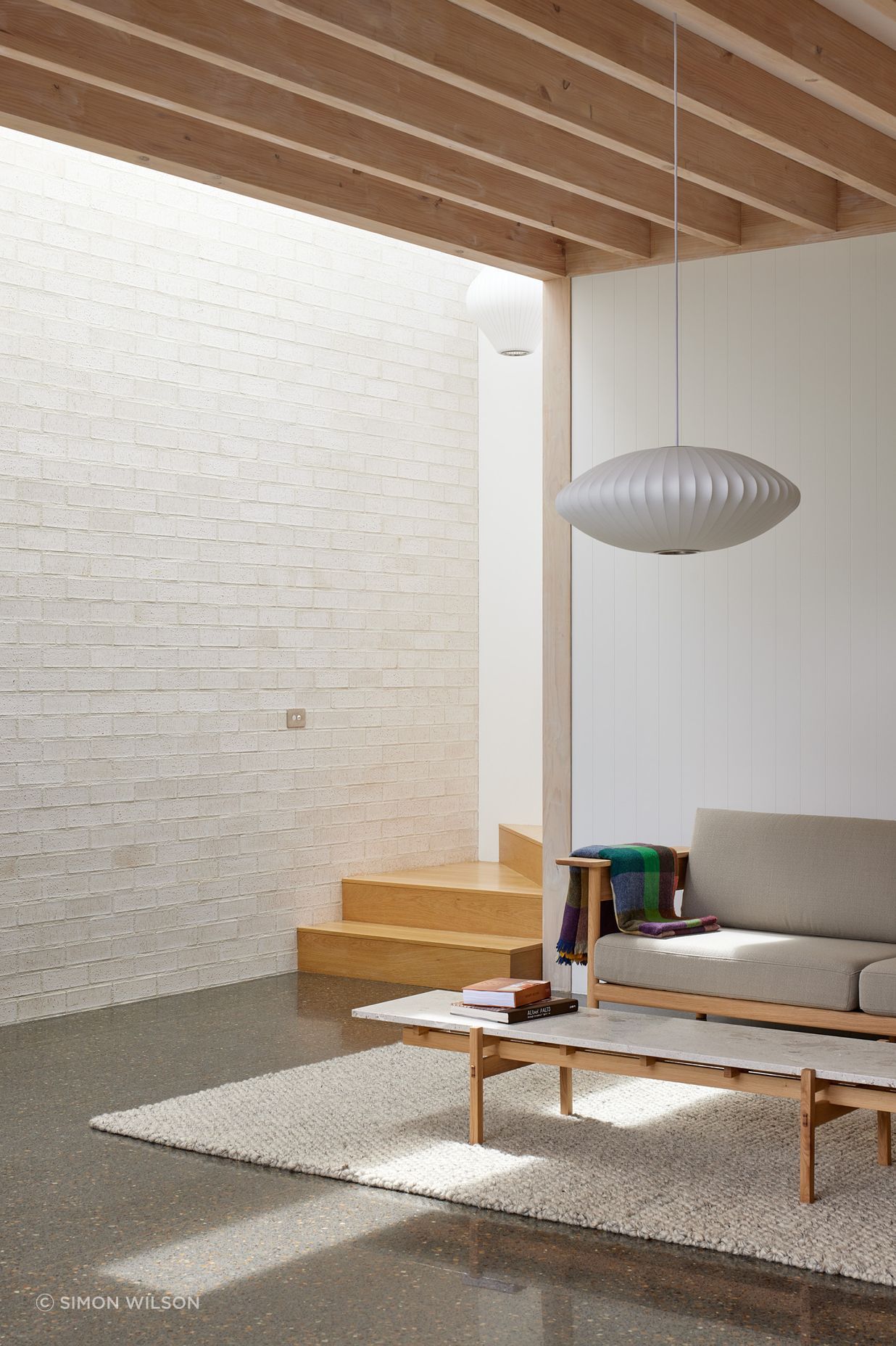 Point House by Guy Tarrant Architects with furniture from Good Form – N-CT01 Coffee Table and N-S01 Sofa by Karimoku Case