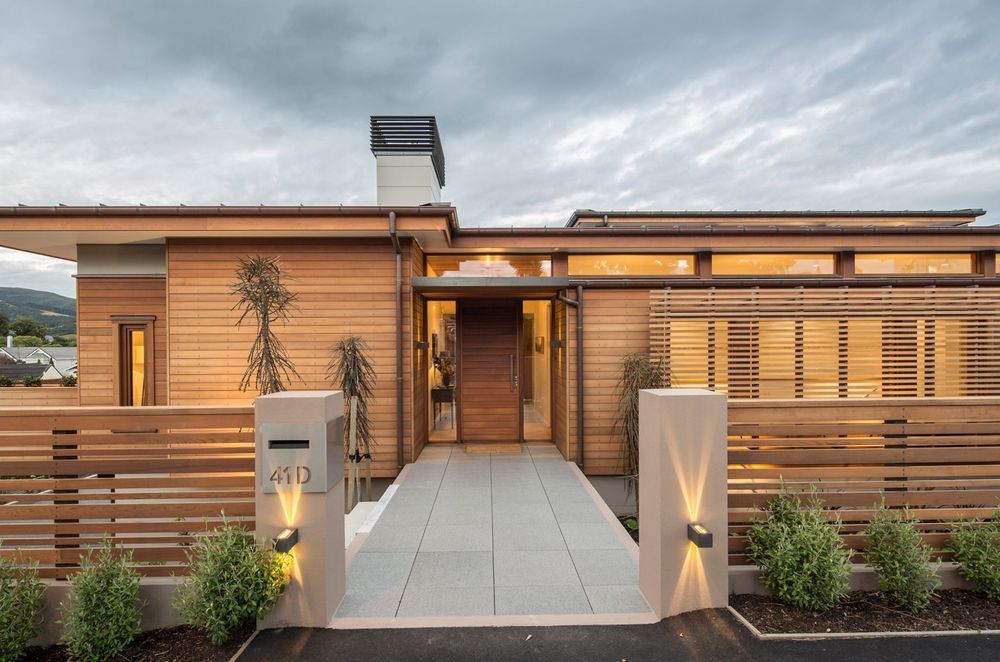 Horizontal cladding on this front door maintains the design theme of this residence in Maori Hill, Dunedin