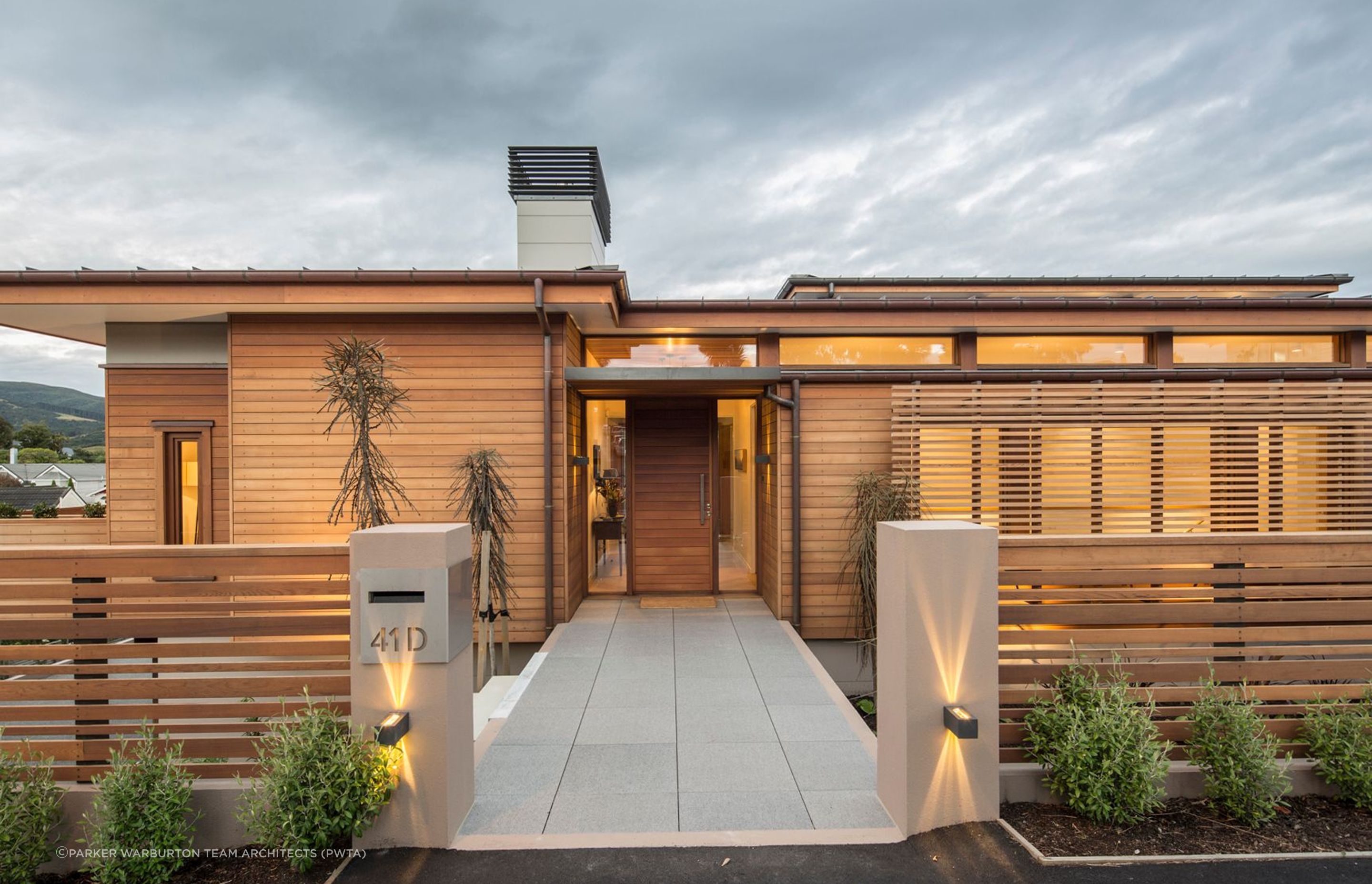 Horizontal cladding on this front door maintains the design theme of this residence in Maori Hill, Dunedin