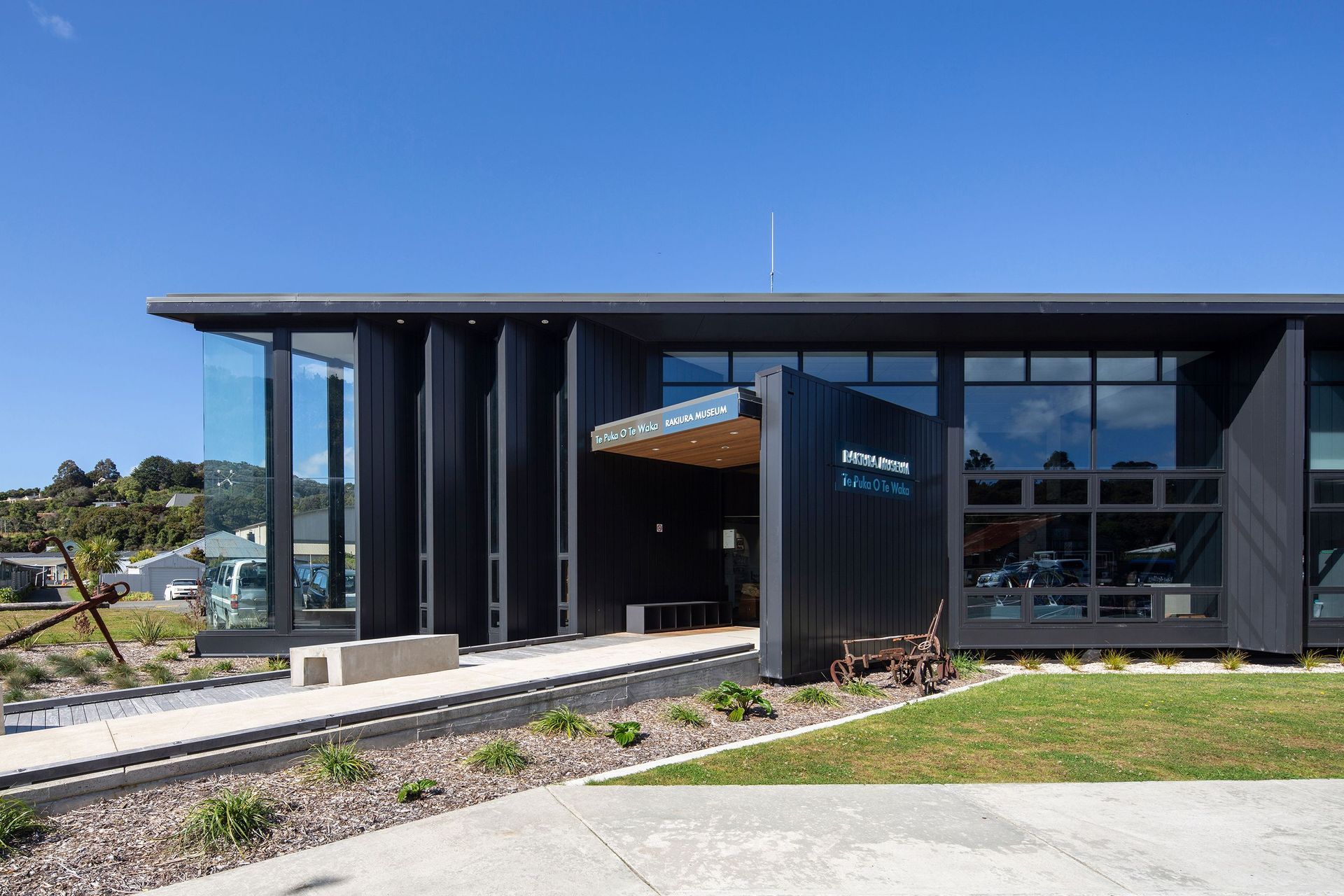 The exterior material palette is predominantly dark painted timber panels, which was all moved into place by hand.