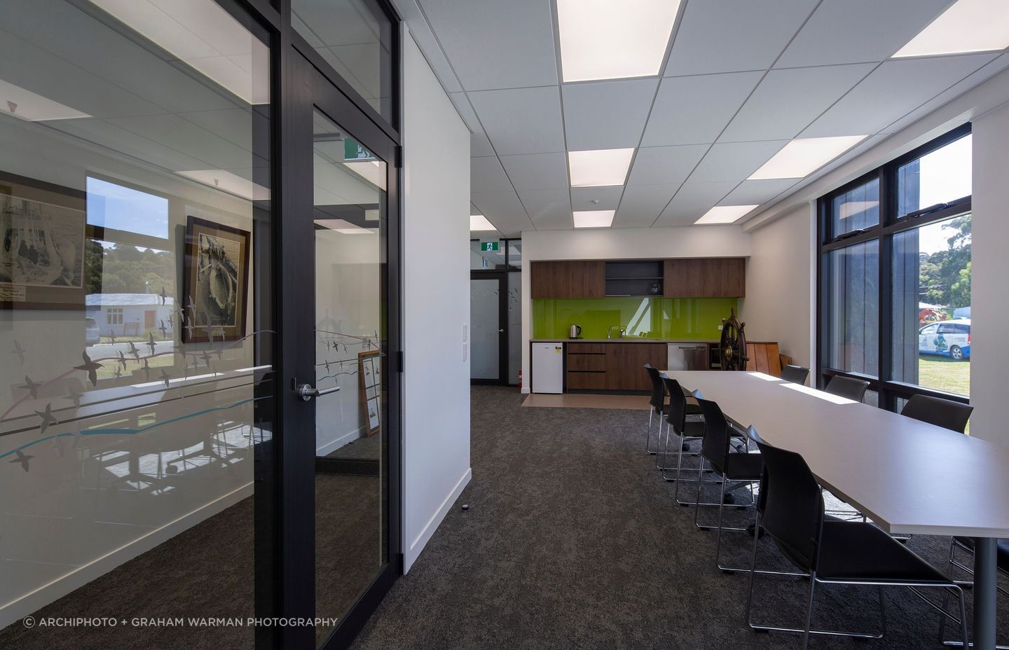 The cafeteria space does double duty as a space for public meetings and social gatherings.