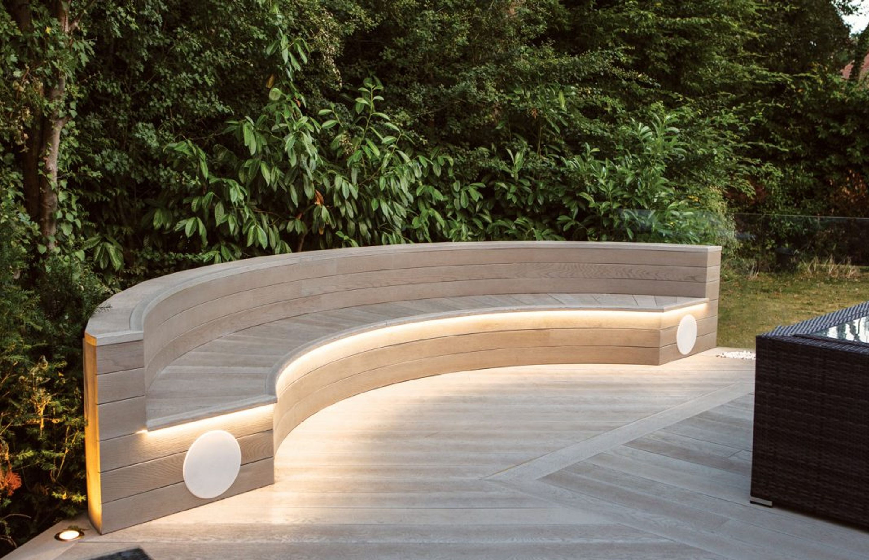 Seating design featuring Millboard's Smoked Oak decking boards and flexible bullnose edging