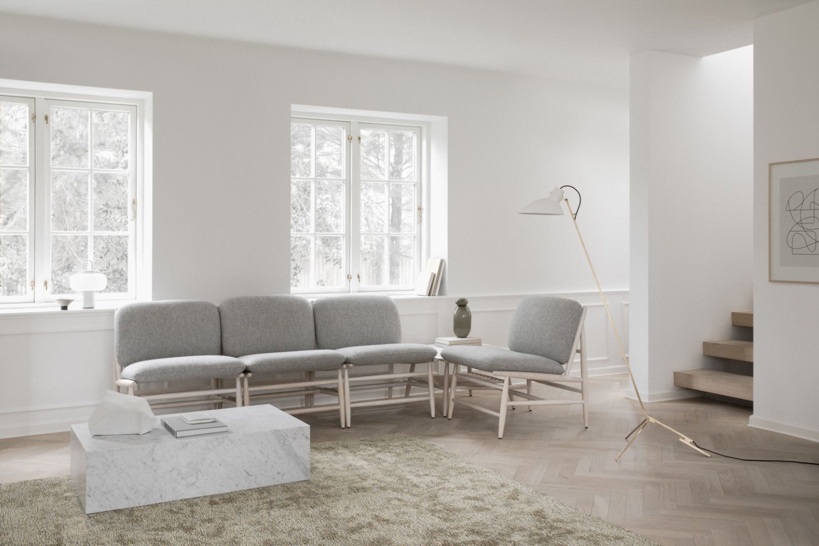 Tucked away parts of a lounge space like a reading area also need attention with focused lighting for reading. A floor or table lamp like the Astep VV Floor Lamp suits this purpose and perches beautifully over a space in a minimal, unobtrusive way with a simple shade and elegant form. Highlight a favourite artwork with a wall lamp to draw the eye around the room and focus on particular, special details.