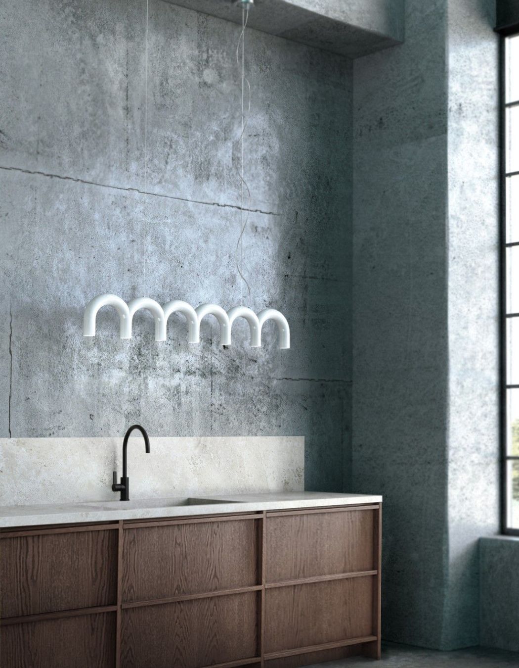 The Oblure Arch Pendant features bold forms and is available in any RAL colour to suit your space.