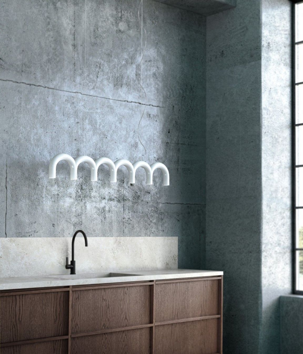 The Oblure Arch Pendant features bold forms and is available in any RAL colour to suit your space.
