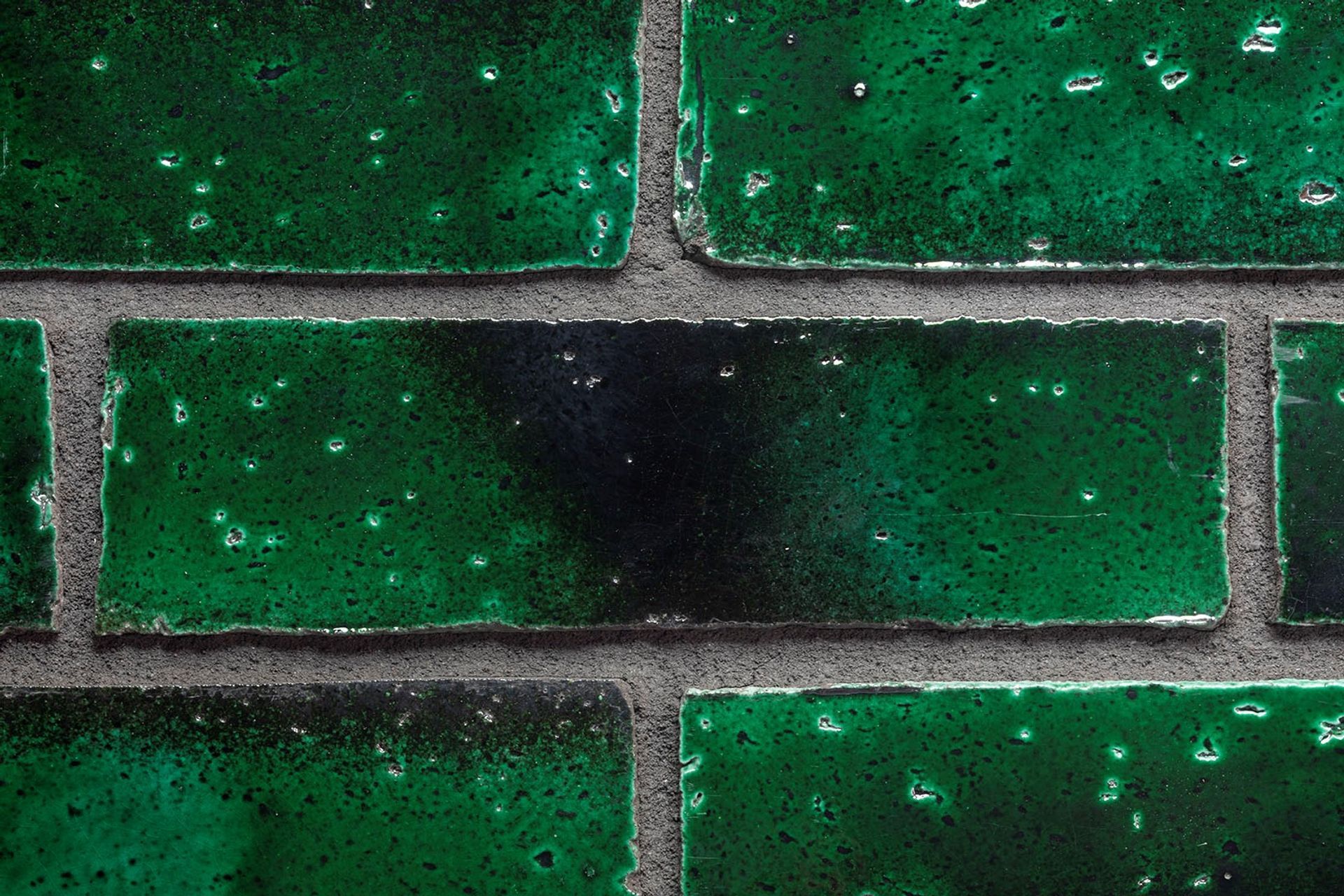 A close up of The Greenhouse's unique iridescent bricks.