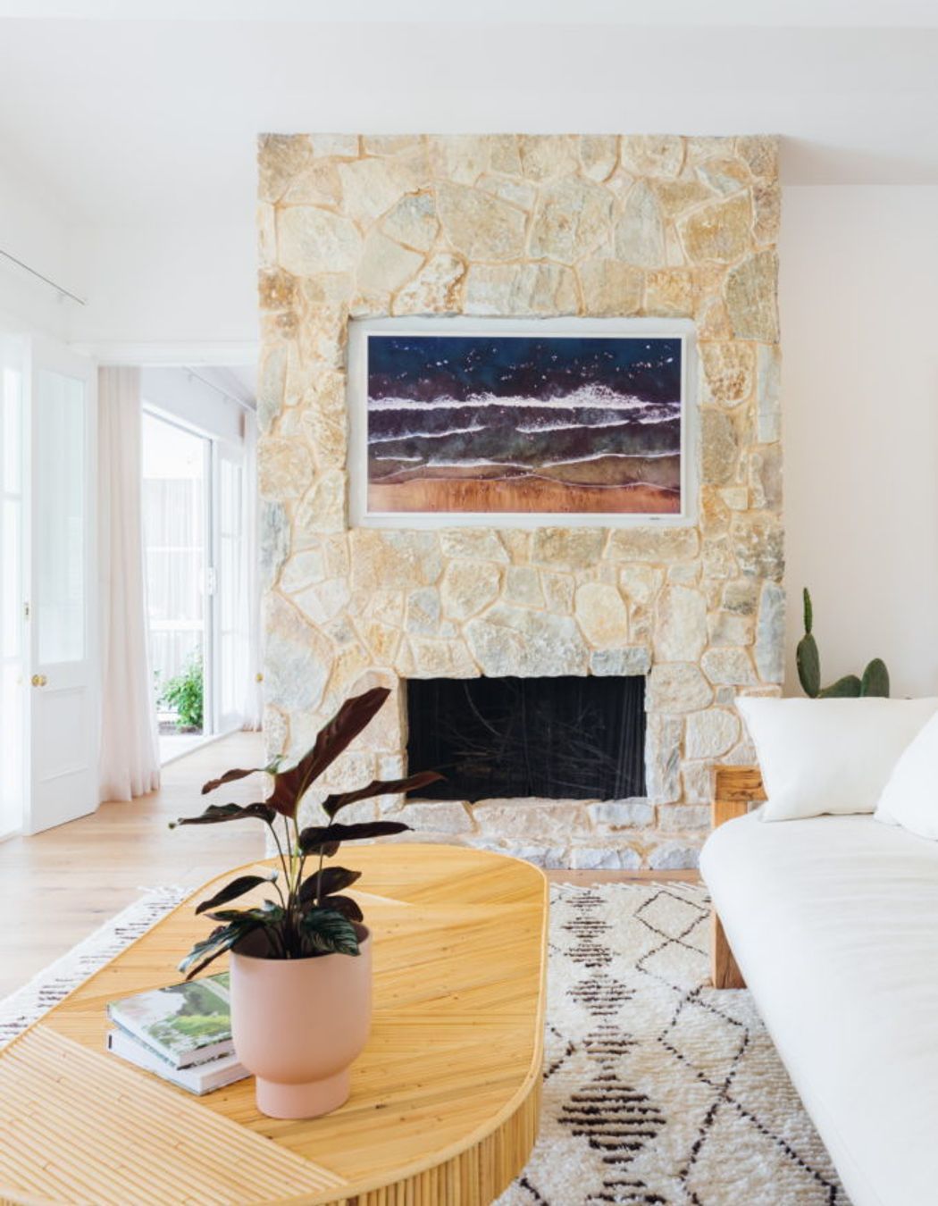Samsung Frame T.V. beautifully recessed into cladded fireplace
