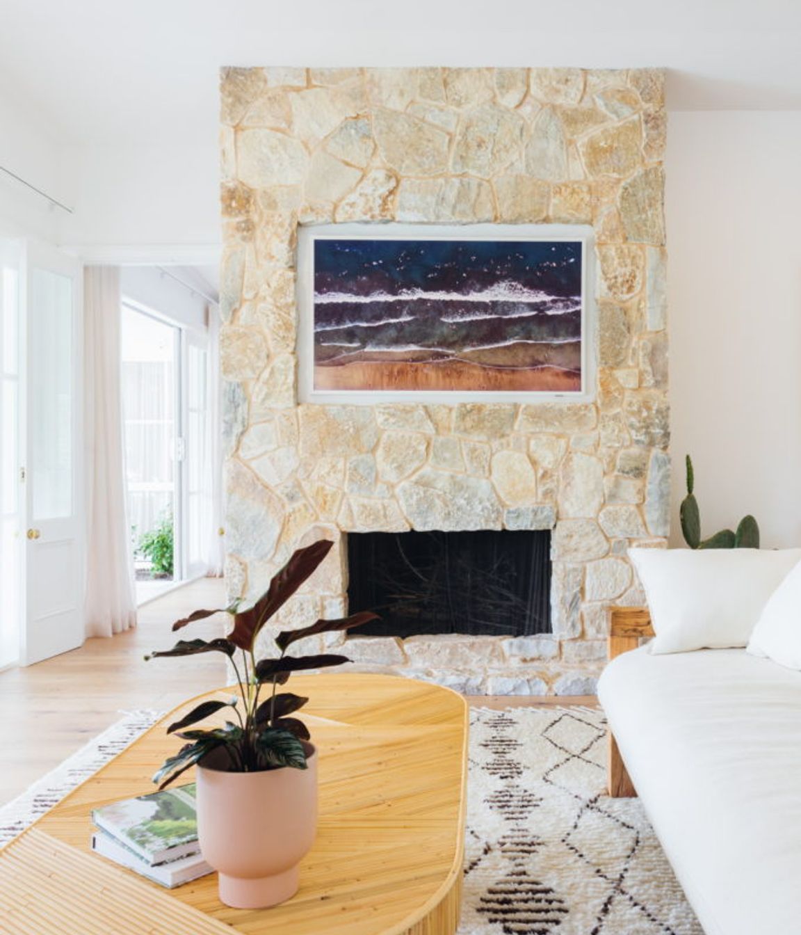 Samsung Frame T.V. beautifully recessed into cladded fireplace