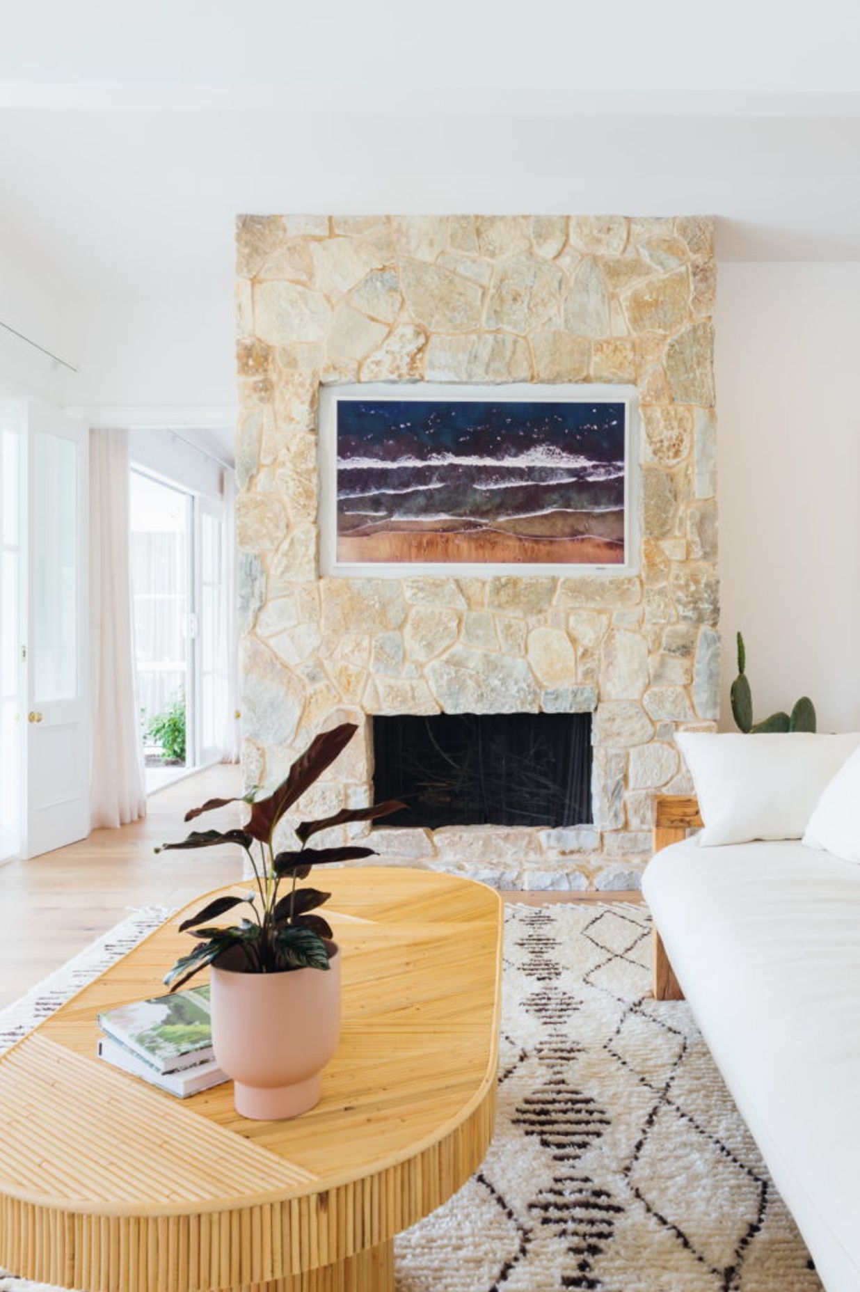 Samsung Frame T.V. beautifully recessed into cladded fireplace