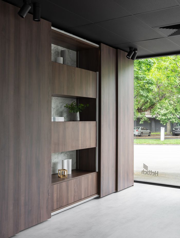 AvanTech YOU drawers can also be found behind the large TopLine XL sliding doors as a shining example of bedroom storage application.