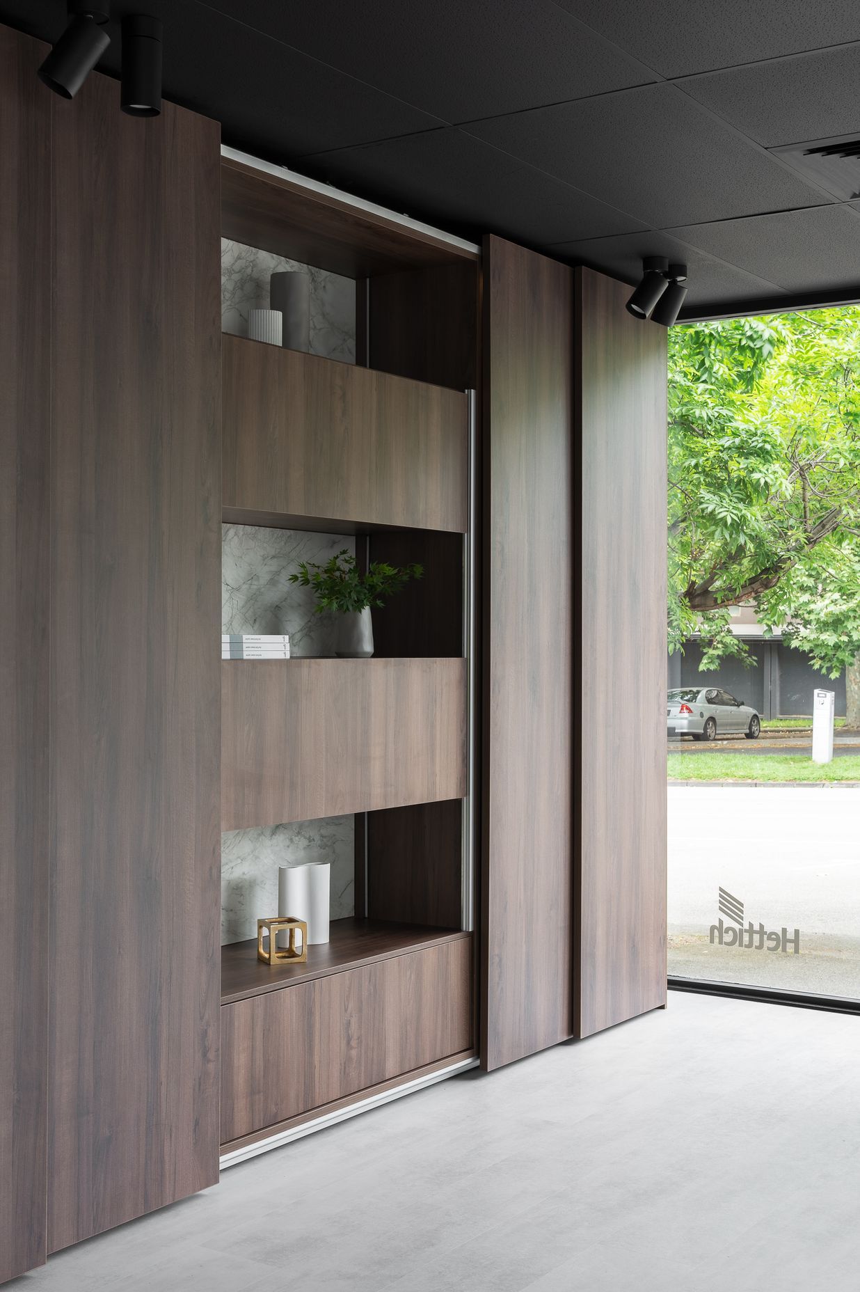 AvanTech YOU drawers can also be found behind the large TopLine XL sliding doors as a shining example of bedroom storage application.