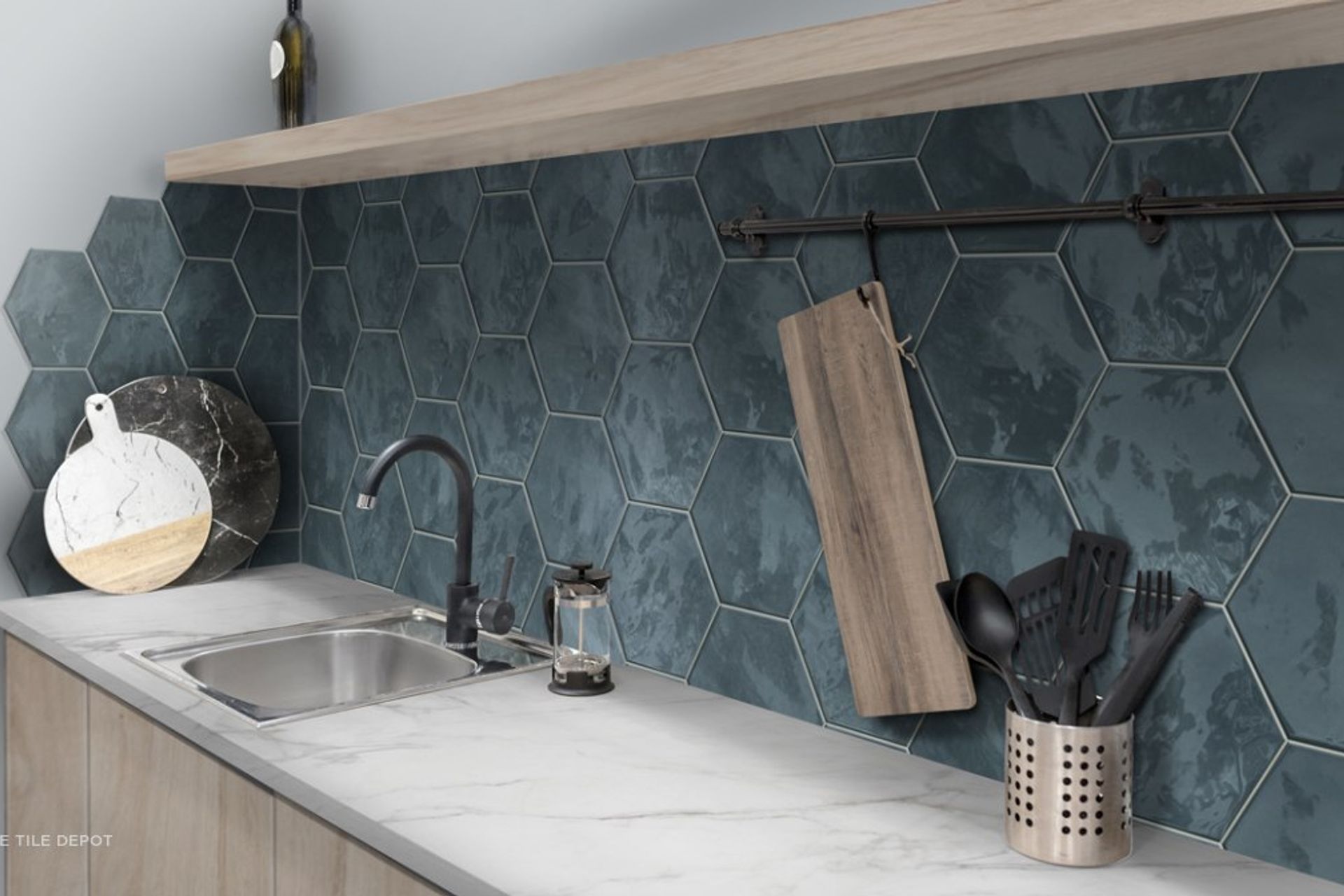 This tiled splashback is textured and has grout lines, however the surface is smooth to touch and the grouting is sealed which makes cleaning easy. This is from the Hexa tile collection at Tile Depot (Tile depot 2021)
