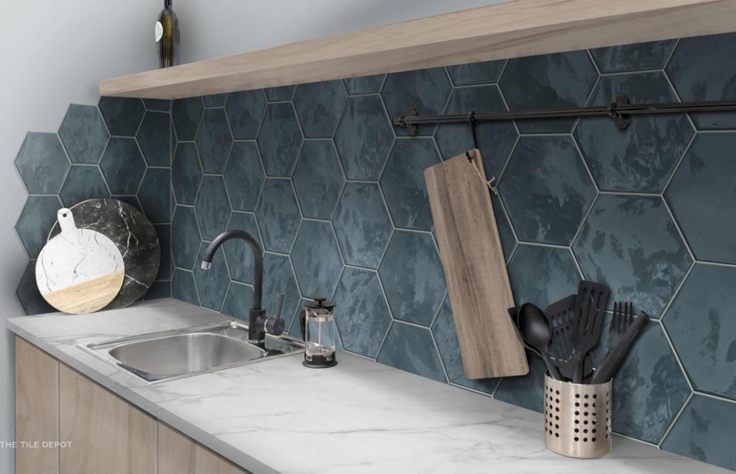 This tiled splashback is textured and has grout lines, however the surface is smooth to touch and the grouting is sealed which makes cleaning easy. This is from the Hexa tile collection at Tile Depot (Tile depot 2021)