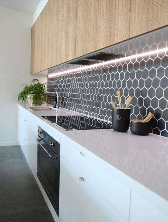 Hexagonal tiles add a retro element to your kitchen design. The surface is still very smooth and the grouting has been sealed to make cleaning easy. (Tile Depot 2021)