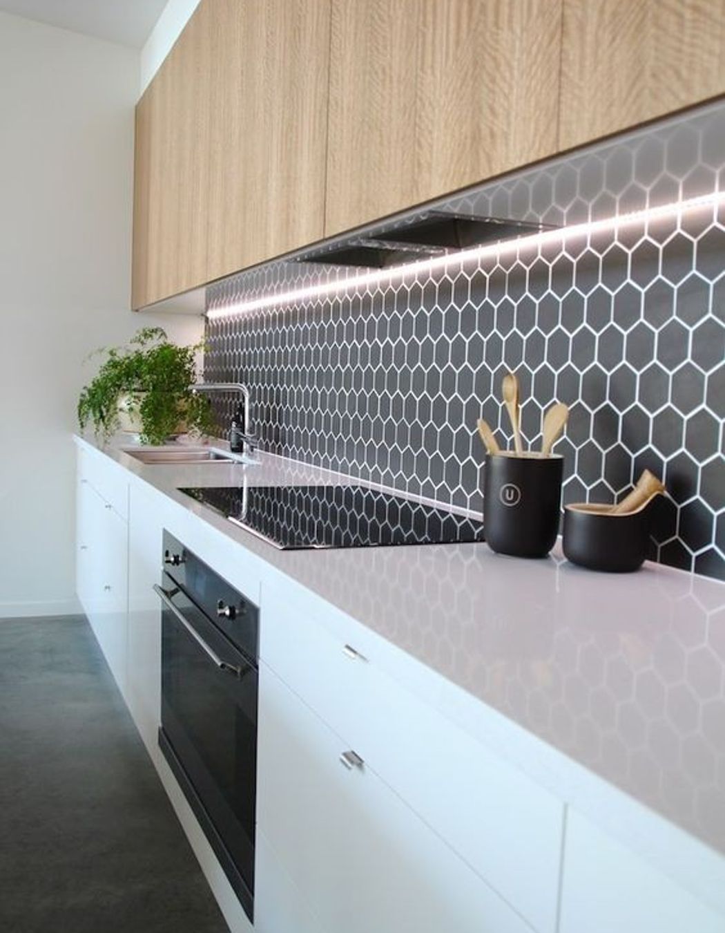 Hexagonal tiles add a retro element to your kitchen design. The surface is still very smooth and the grouting has been sealed to make cleaning easy. (Tile Depot 2021)
