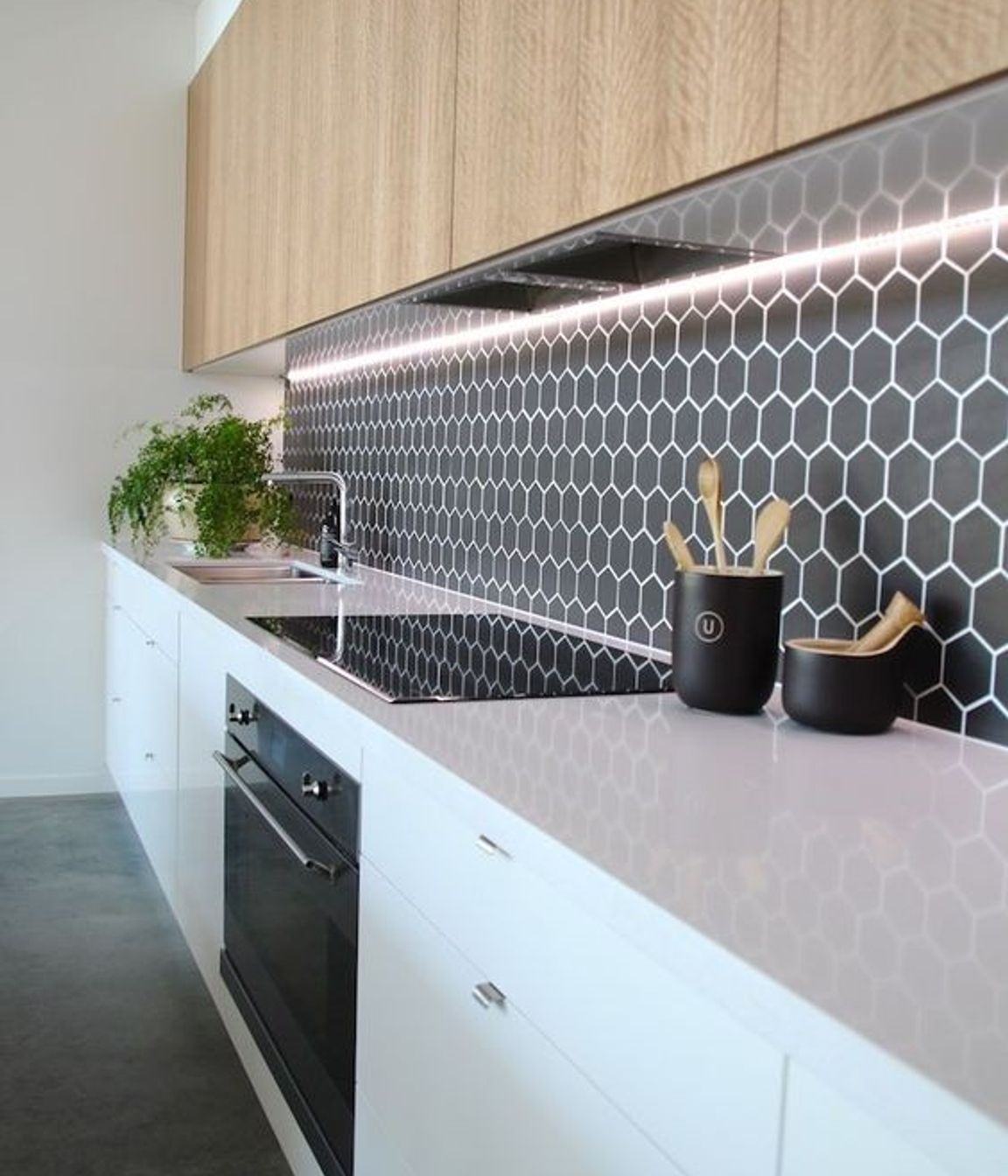 Hexagonal tiles add a retro element to your kitchen design. The surface is still very smooth and the grouting has been sealed to make cleaning easy. (Tile Depot 2021)