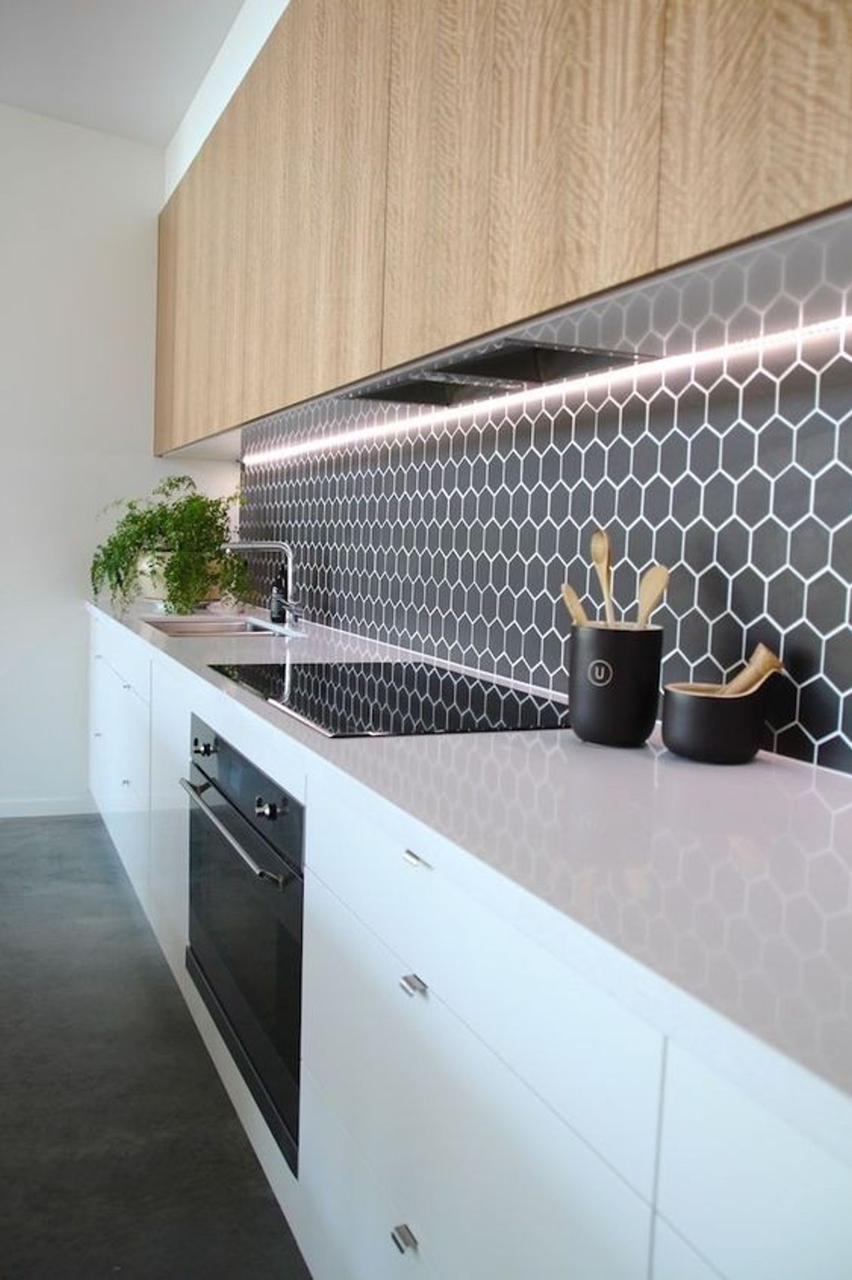Hexagonal tiles add a retro element to your kitchen design. The surface is still very smooth and the grouting has been sealed to make cleaning easy. (Tile Depot 2021)