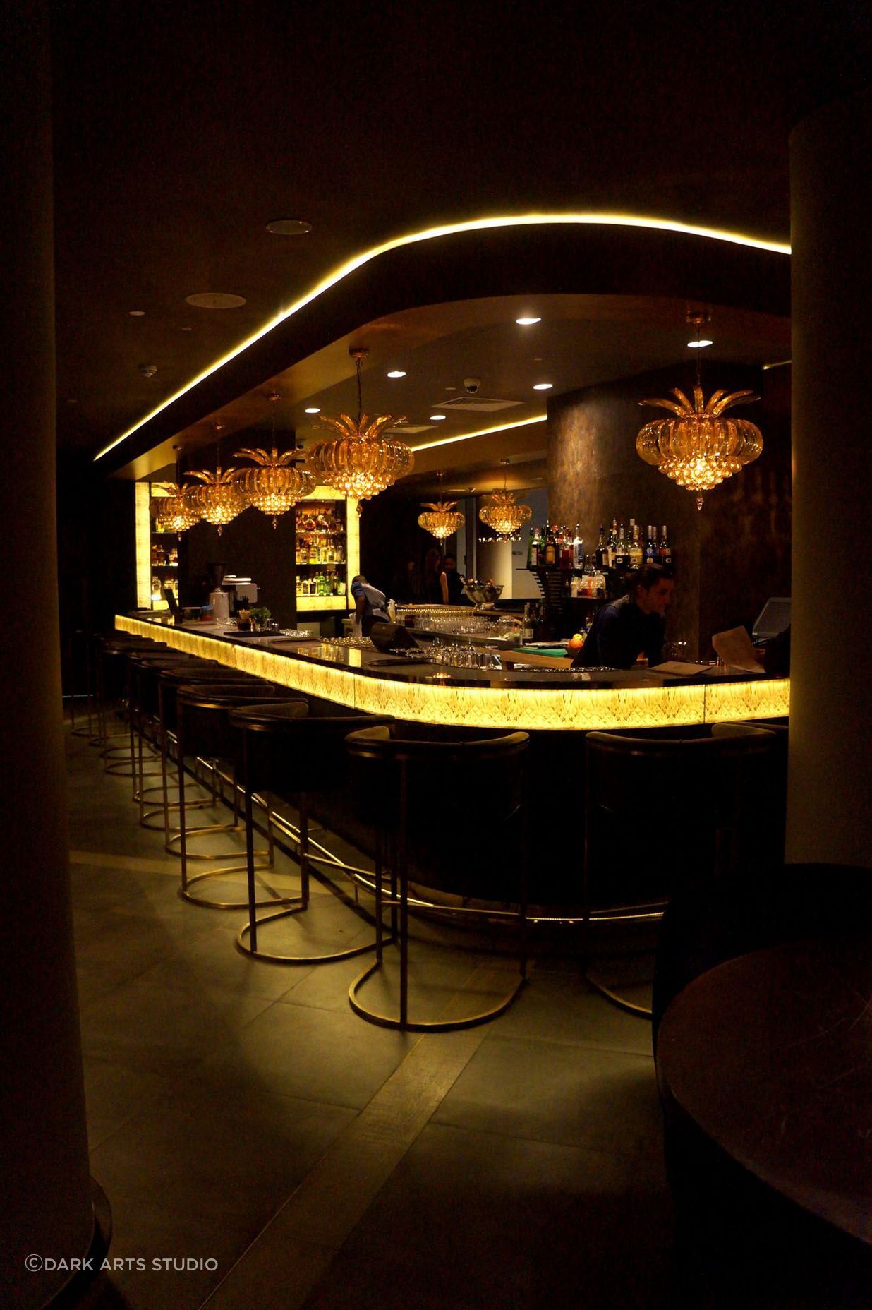 Darkarts Studios created a dark and moody lighting plan for the Hilton's Sky Bar, designed to reduce window reflection.